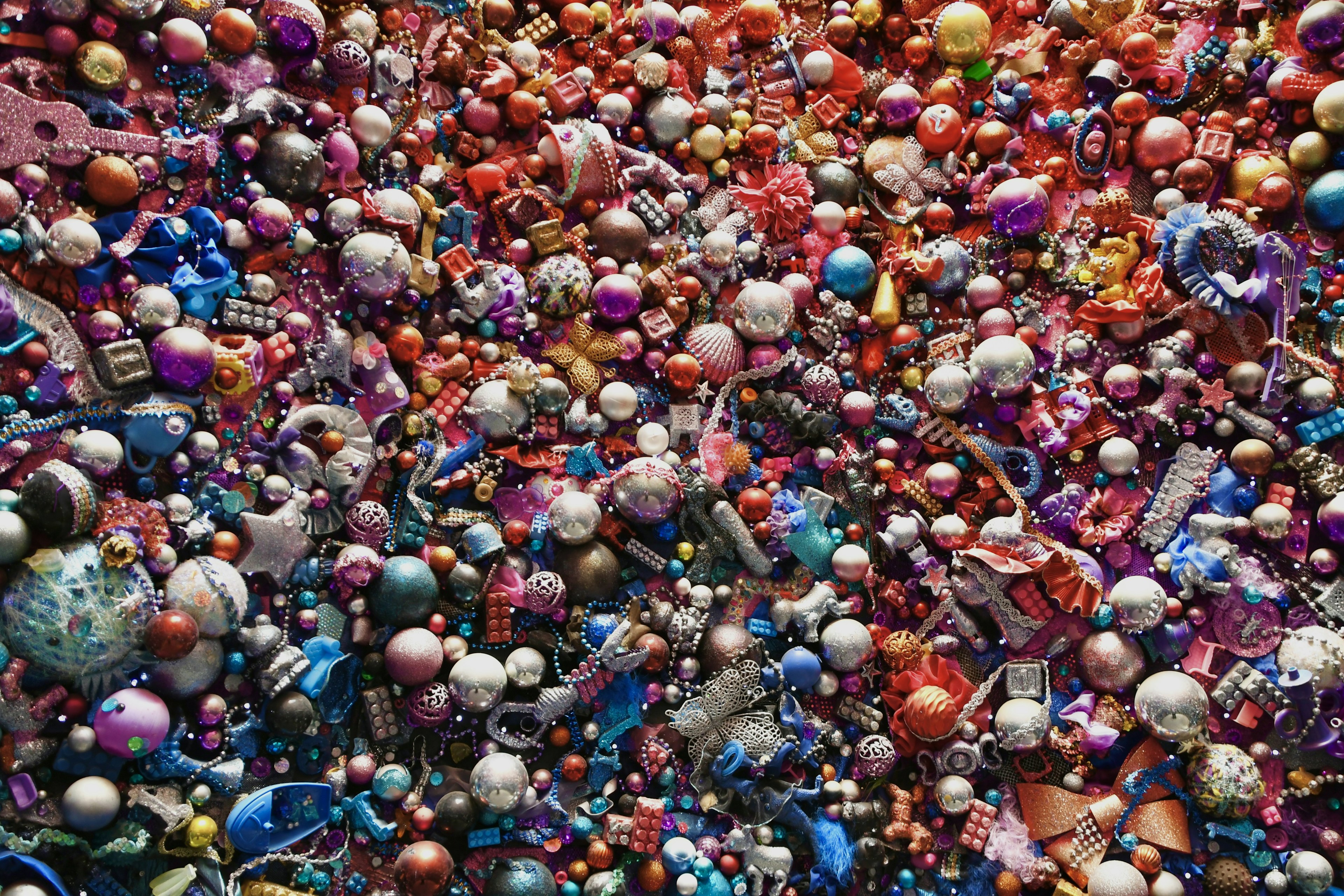 A vibrant assortment of beads and decorative items scattered across a surface