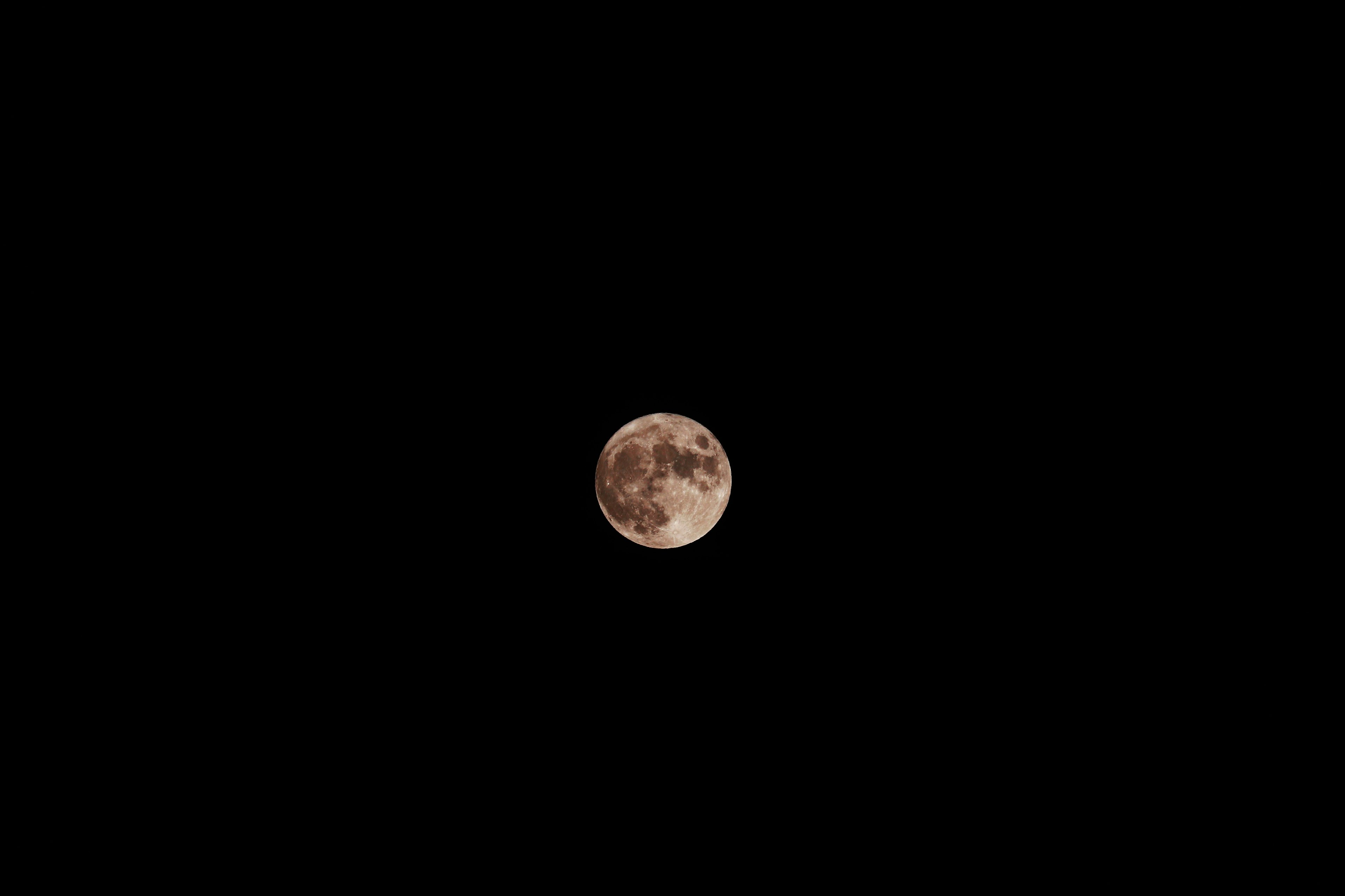 Close-up of a bright moon in the night sky