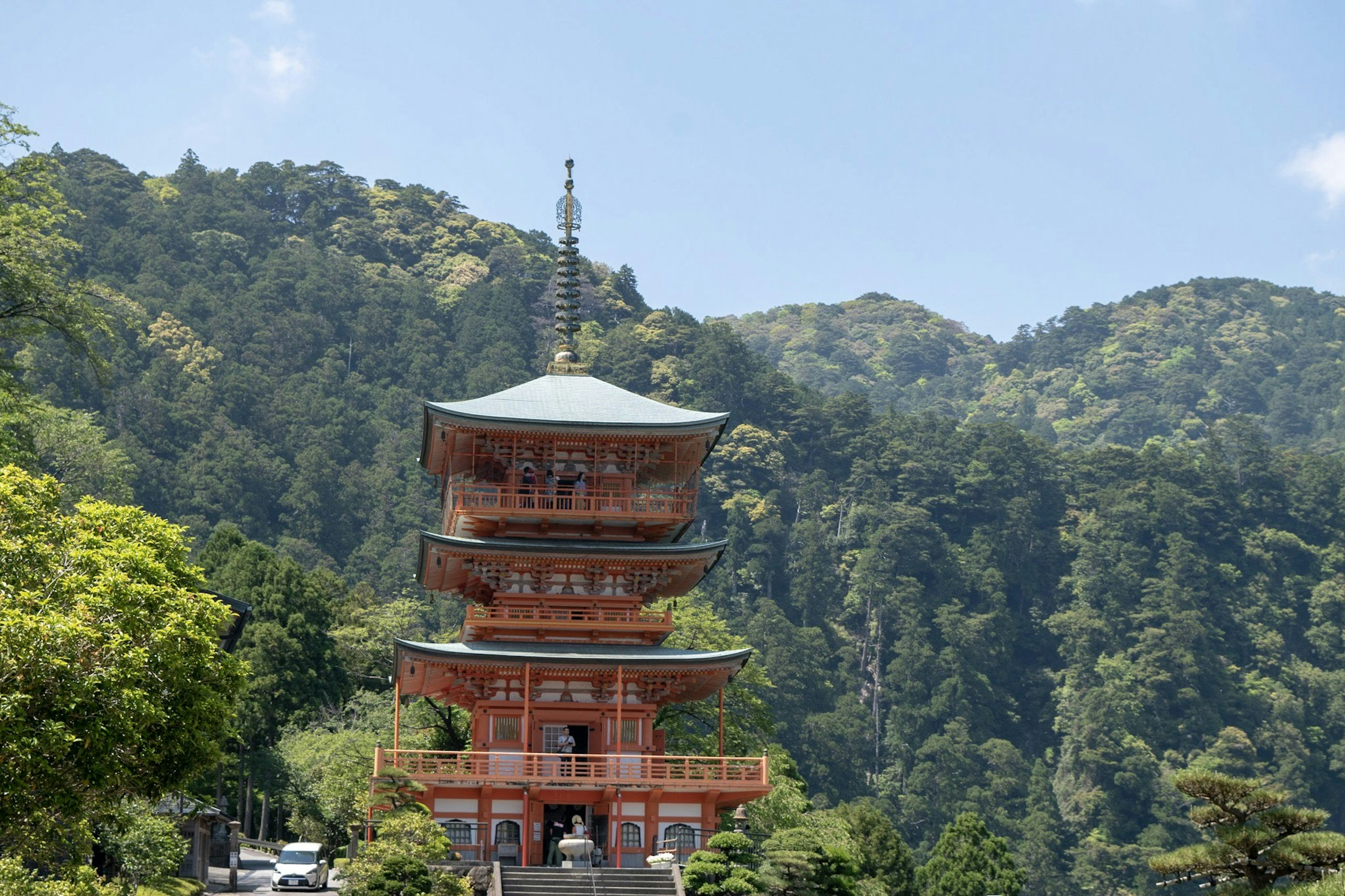 Scenic view of a five-story pagoda surrounded by lush mountains