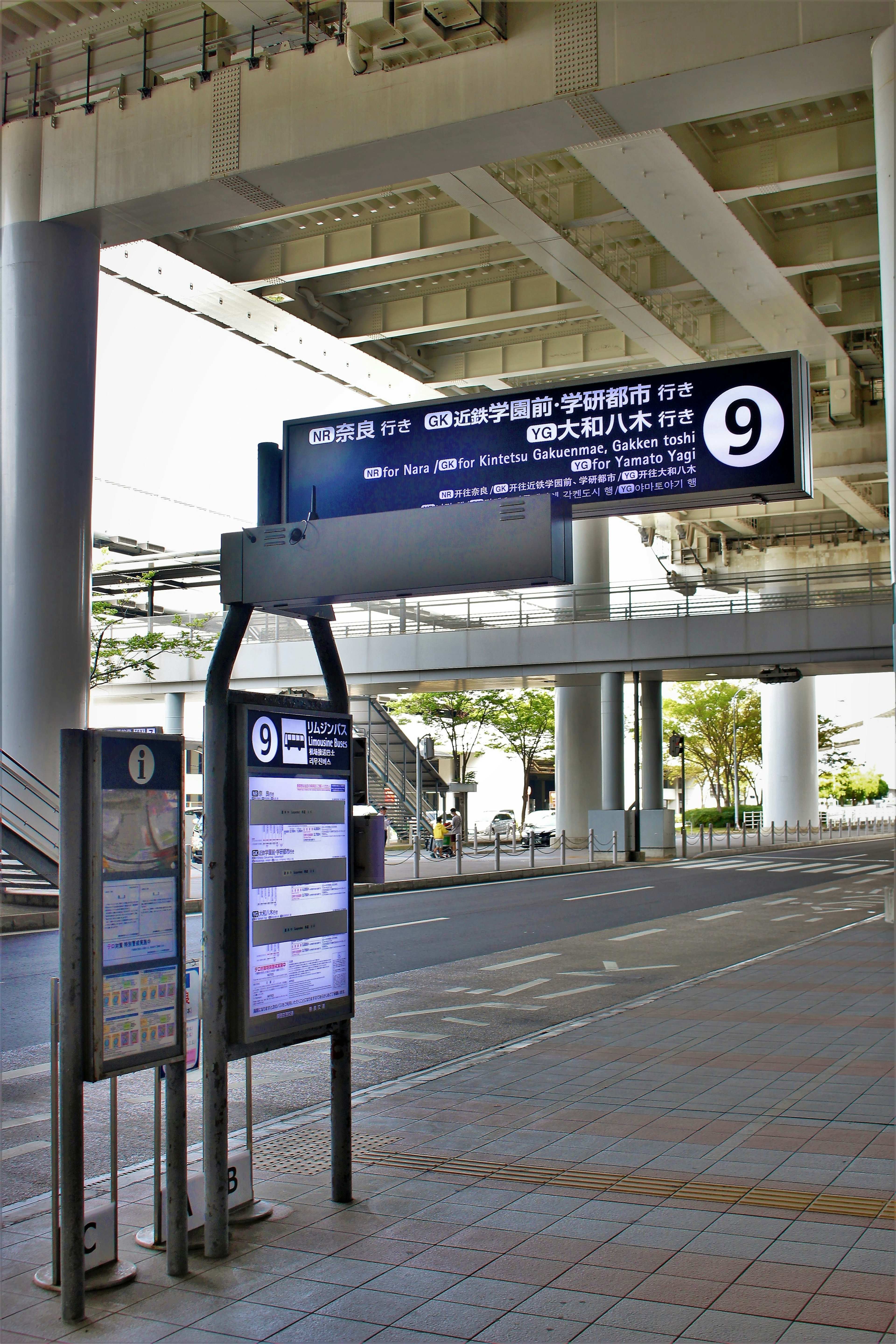 Platform signage and information boards at a train station