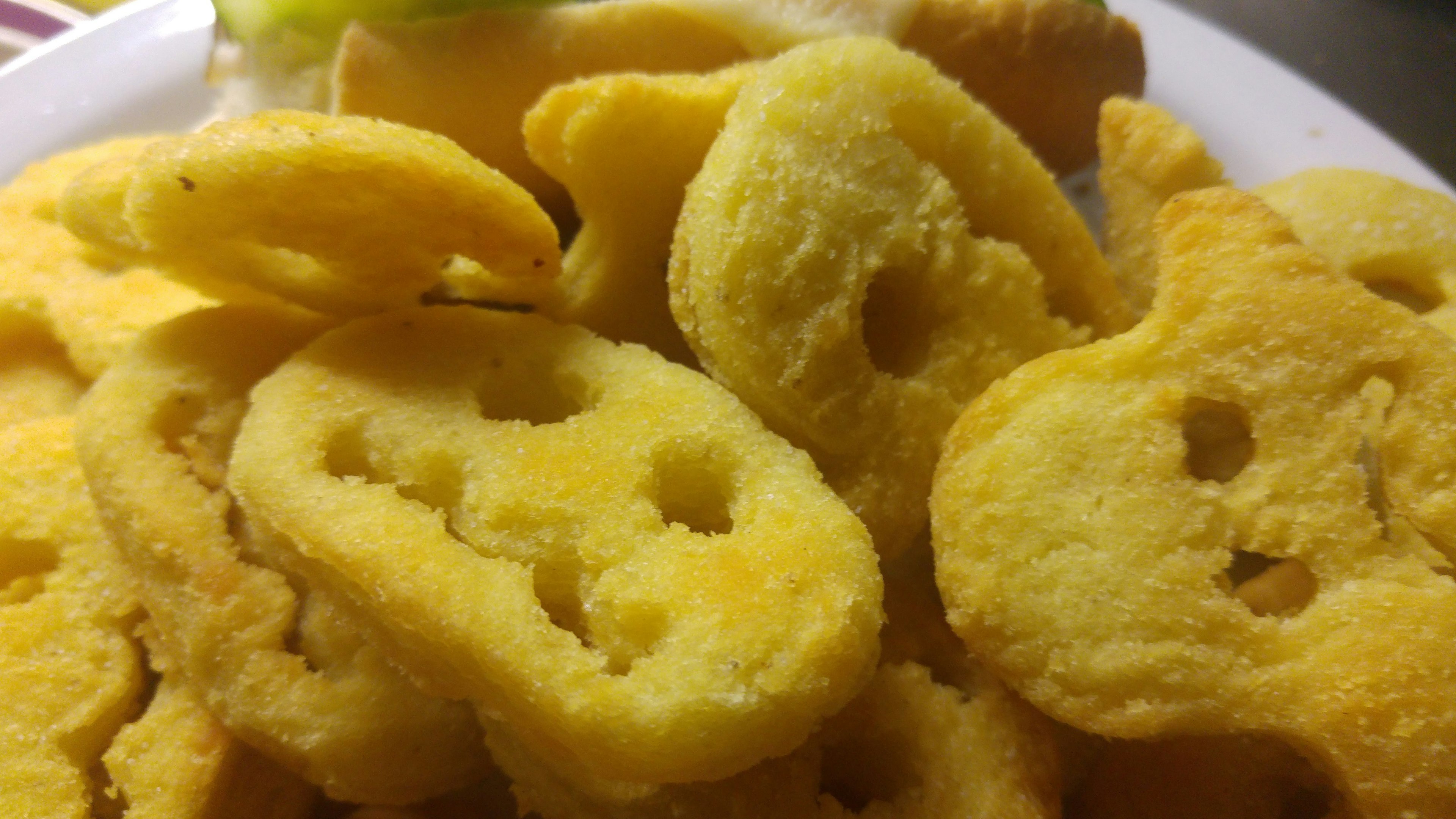 Yellow snacks arranged on a plate