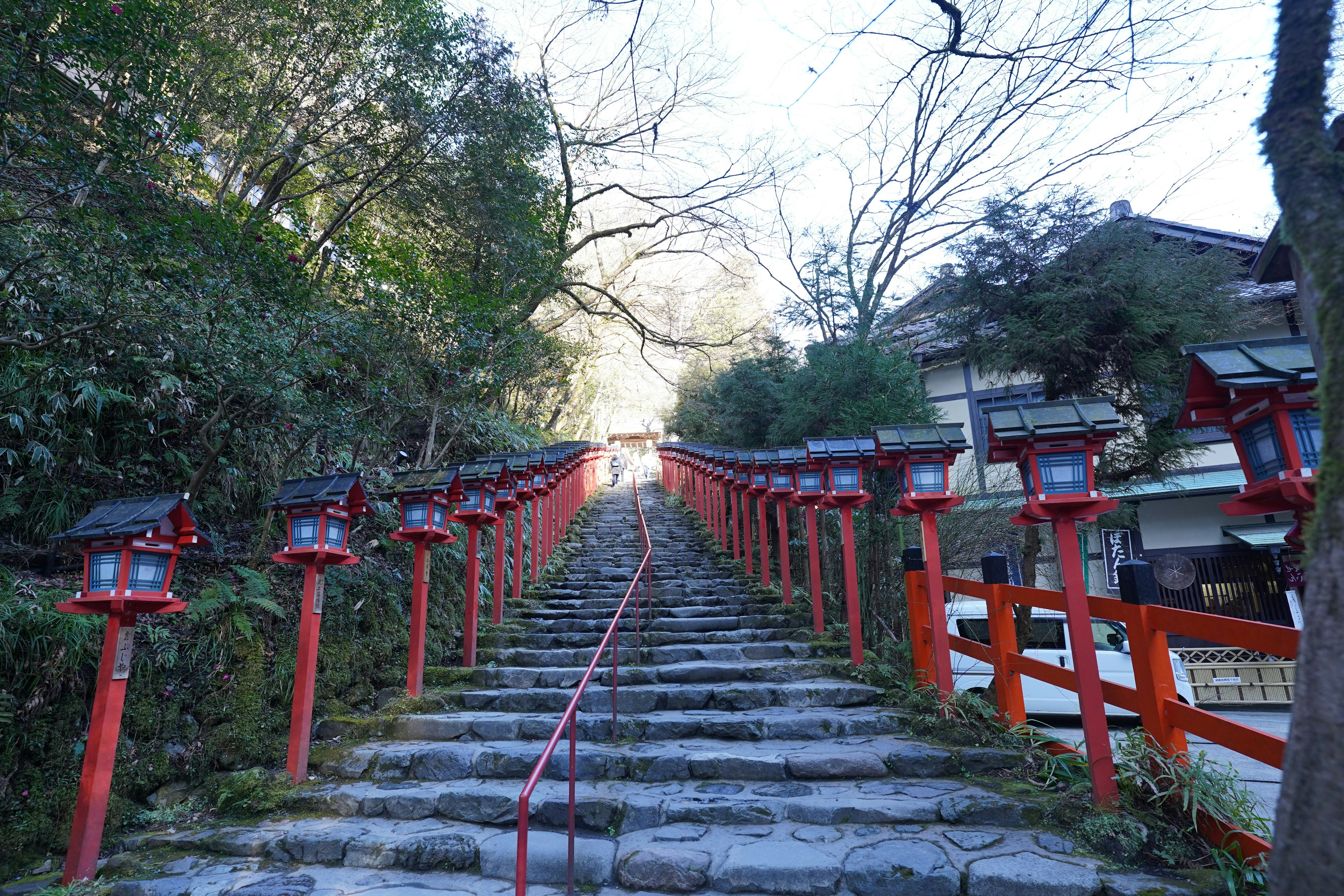 Stone steps leading up with red lanterns on either side