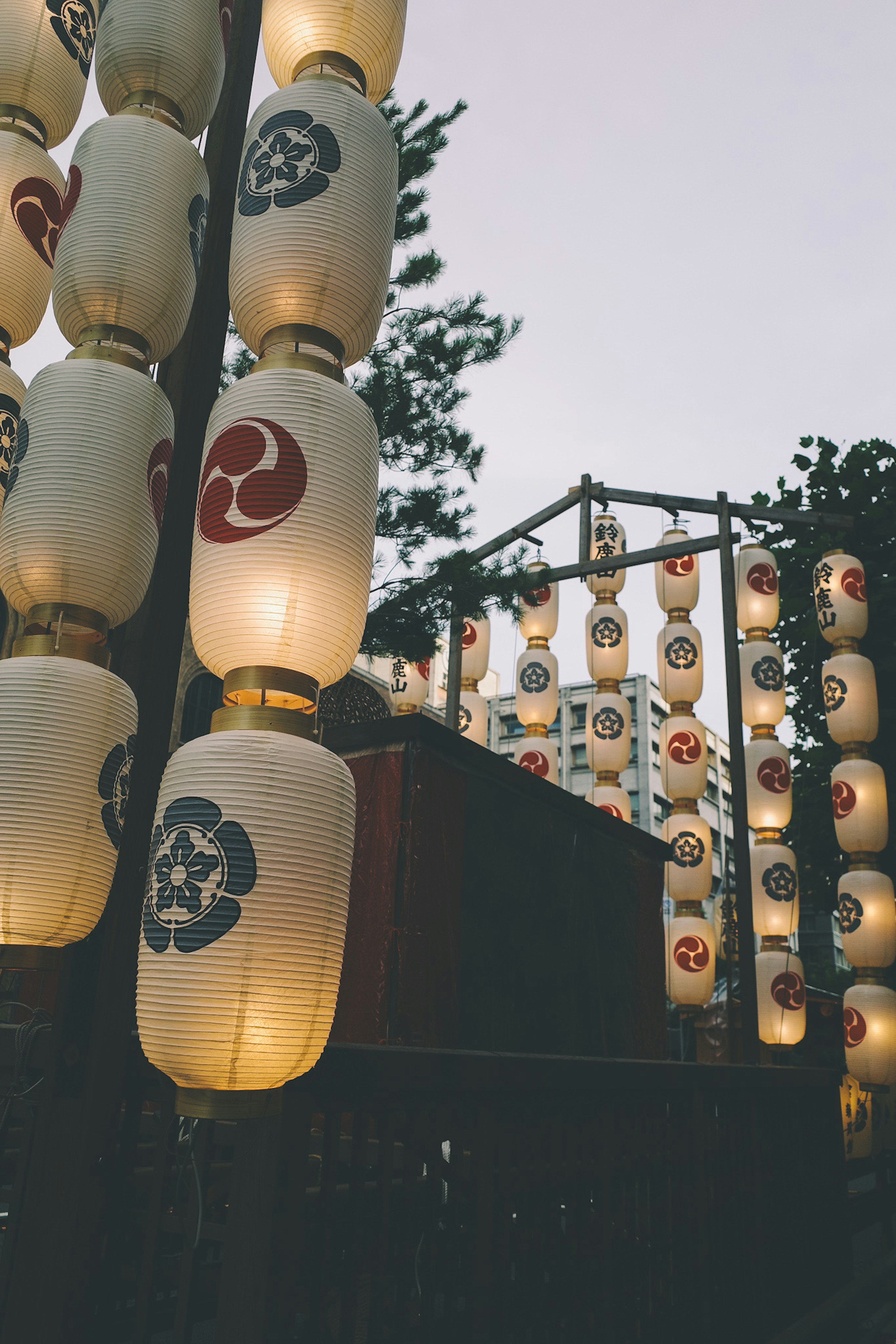 Illuminated lanterns at a festival with traditional designs