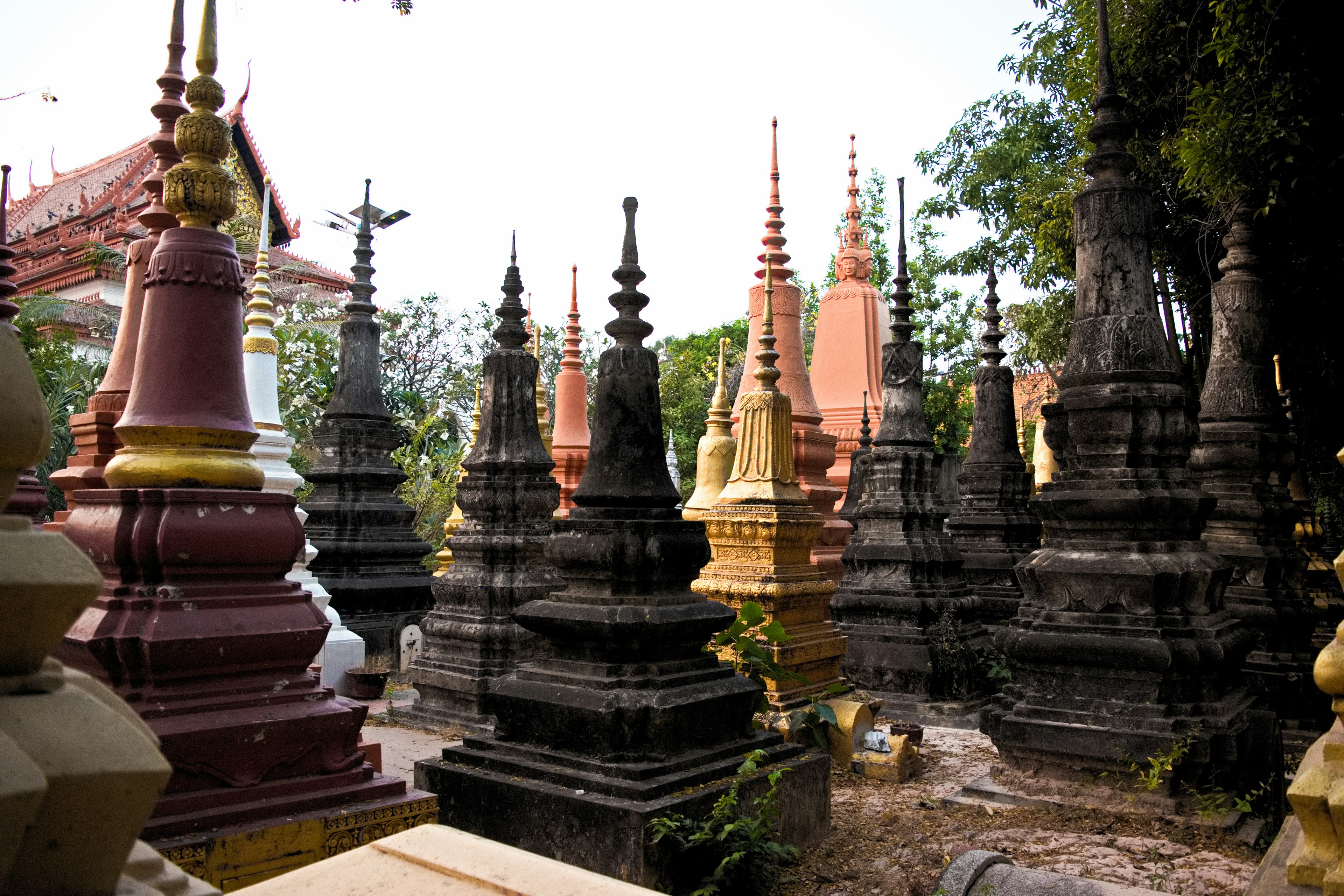 A landscape of various colored stupas in a temple