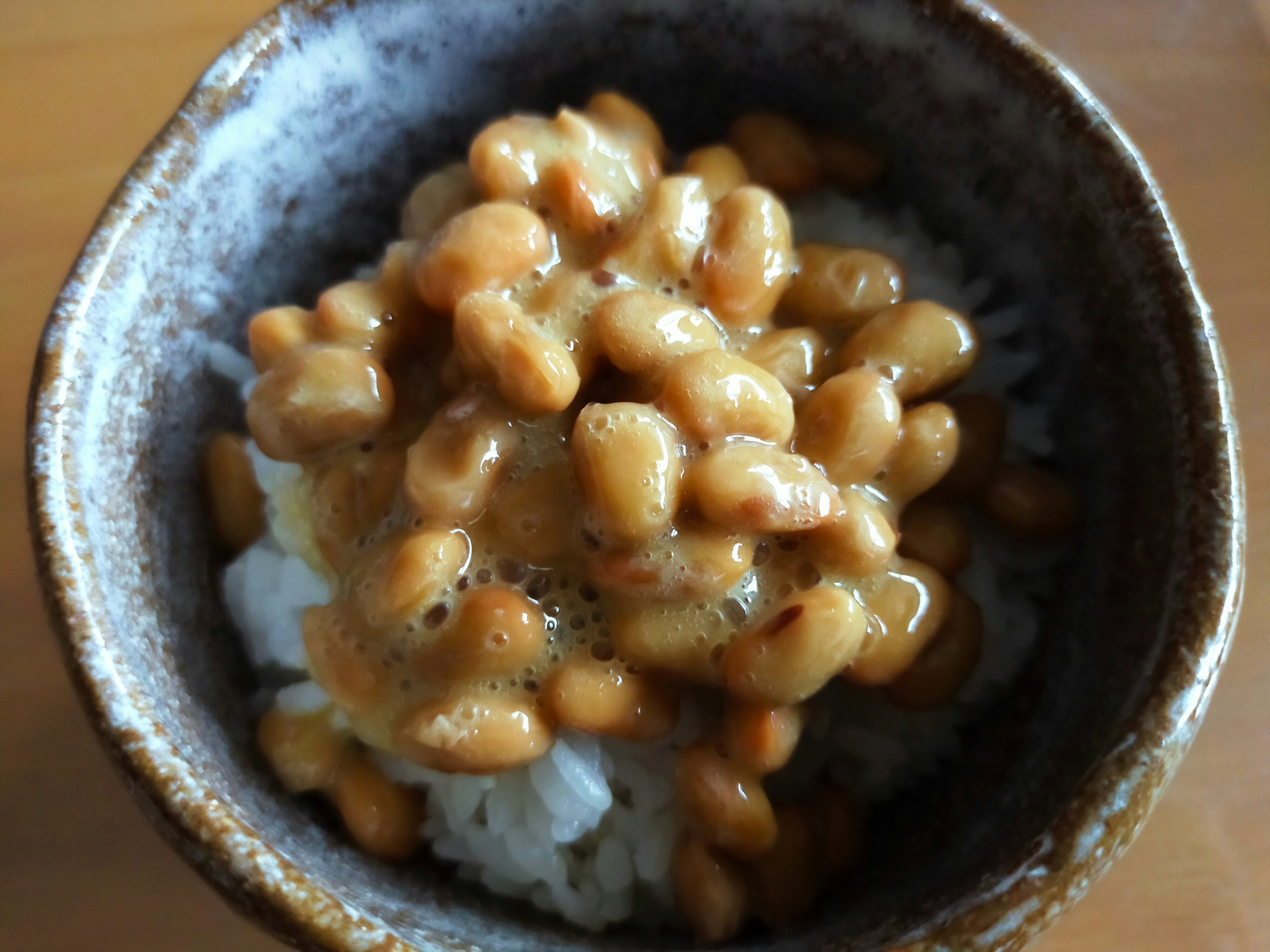 A bowl of rice topped with natto, a traditional Japanese dish