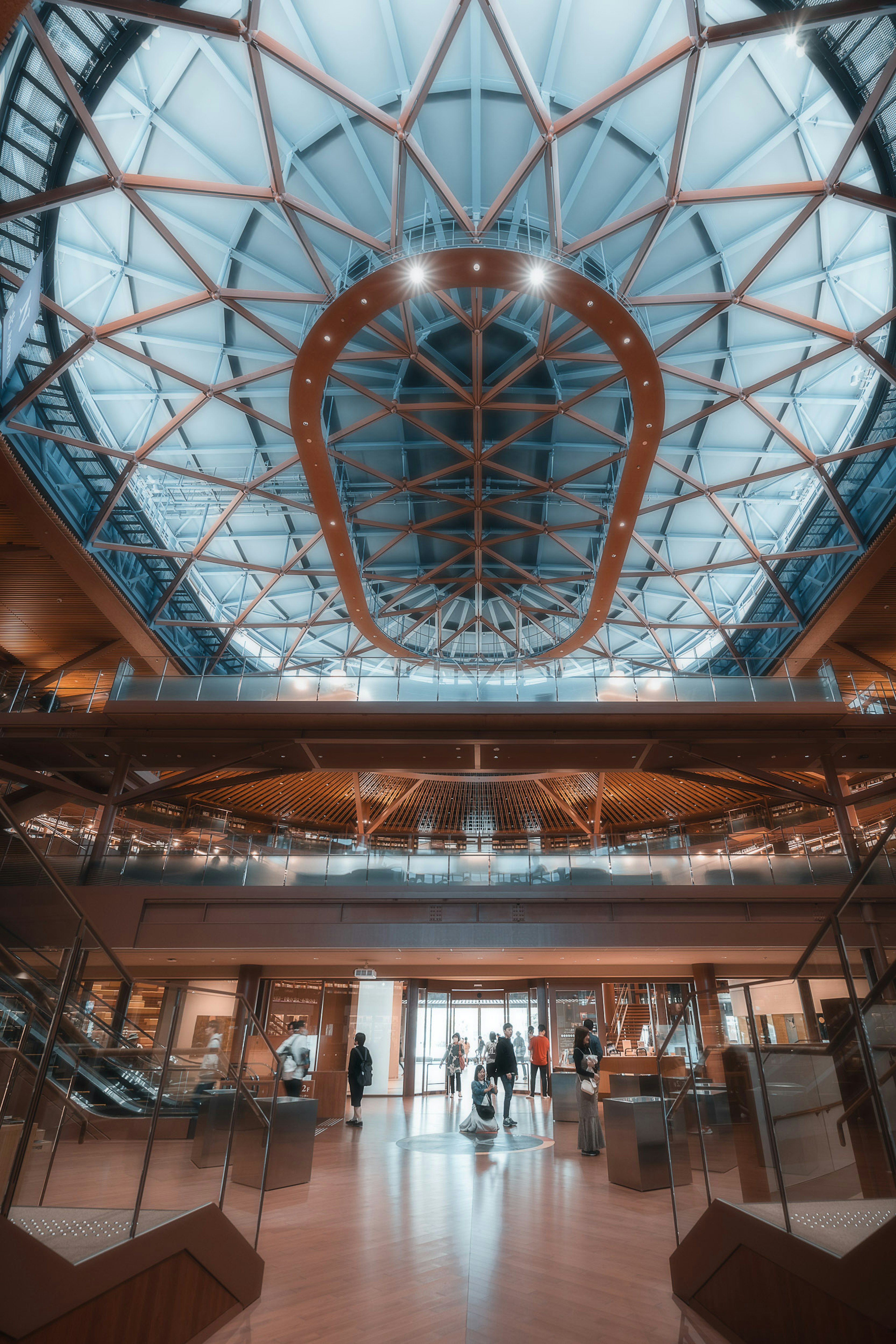 Modern architectural interior featuring a glass ceiling and wooden structure