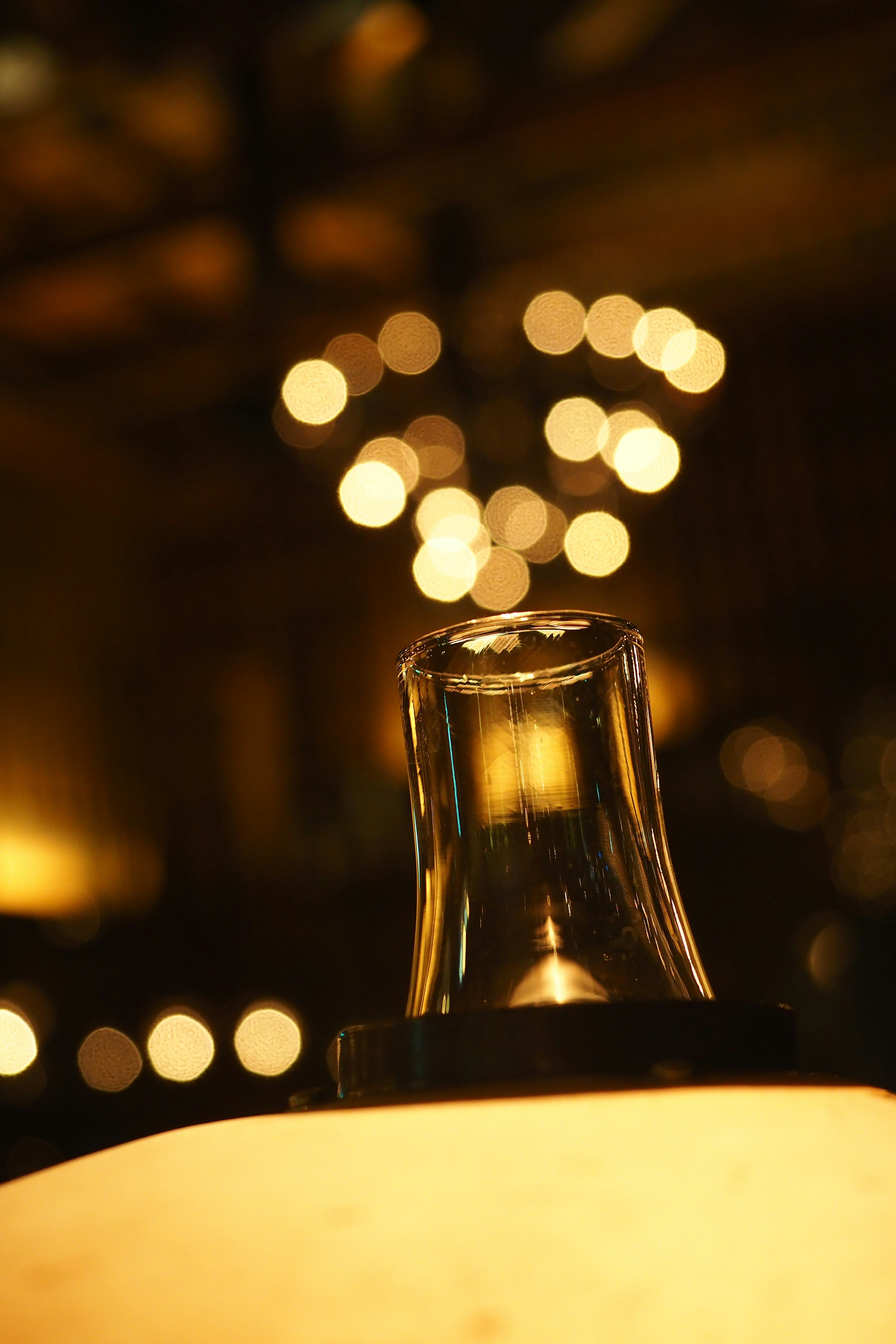 Glass lamp with a blurred light background