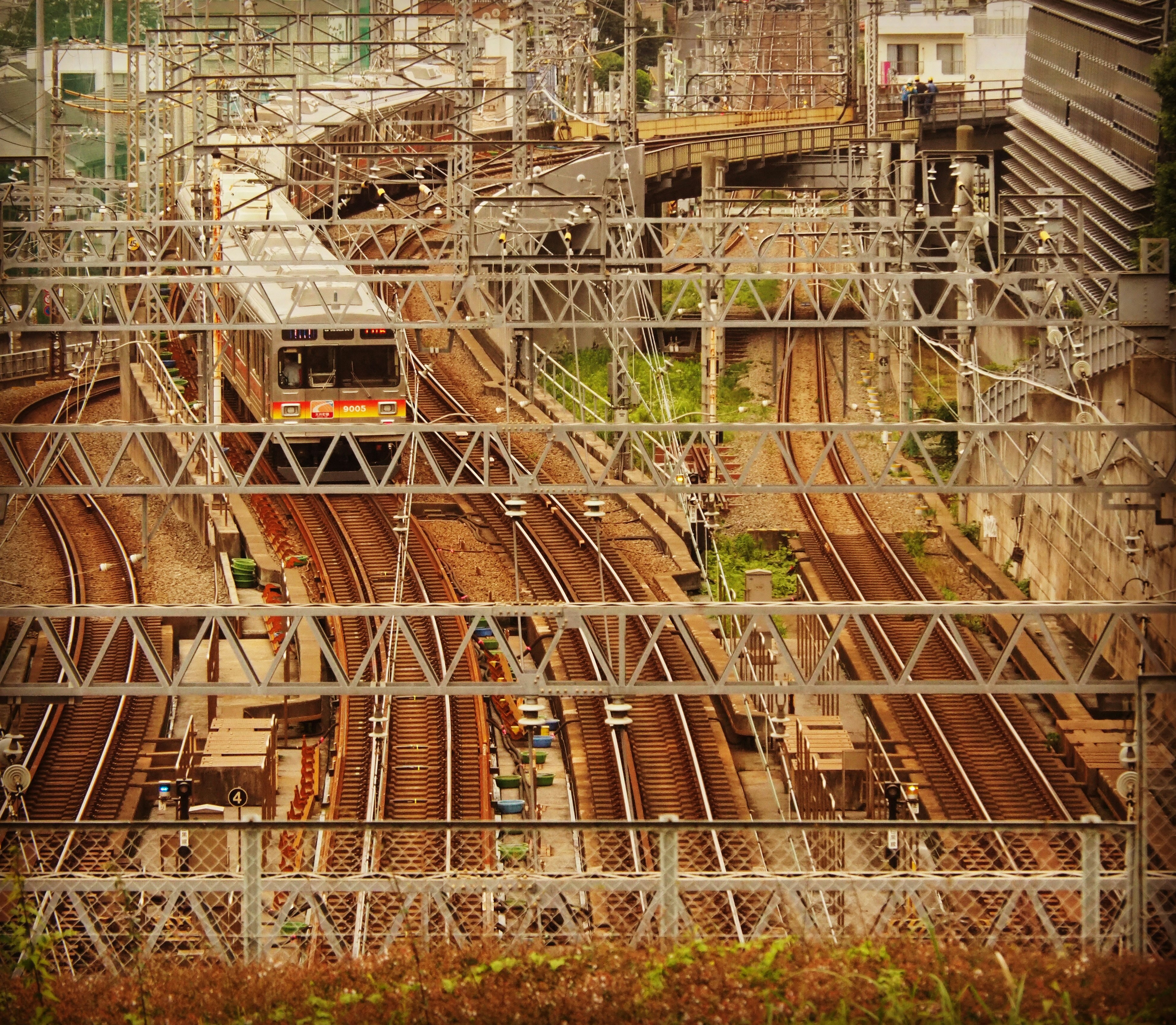 Complex railway tracks and overhead lines in a city setting