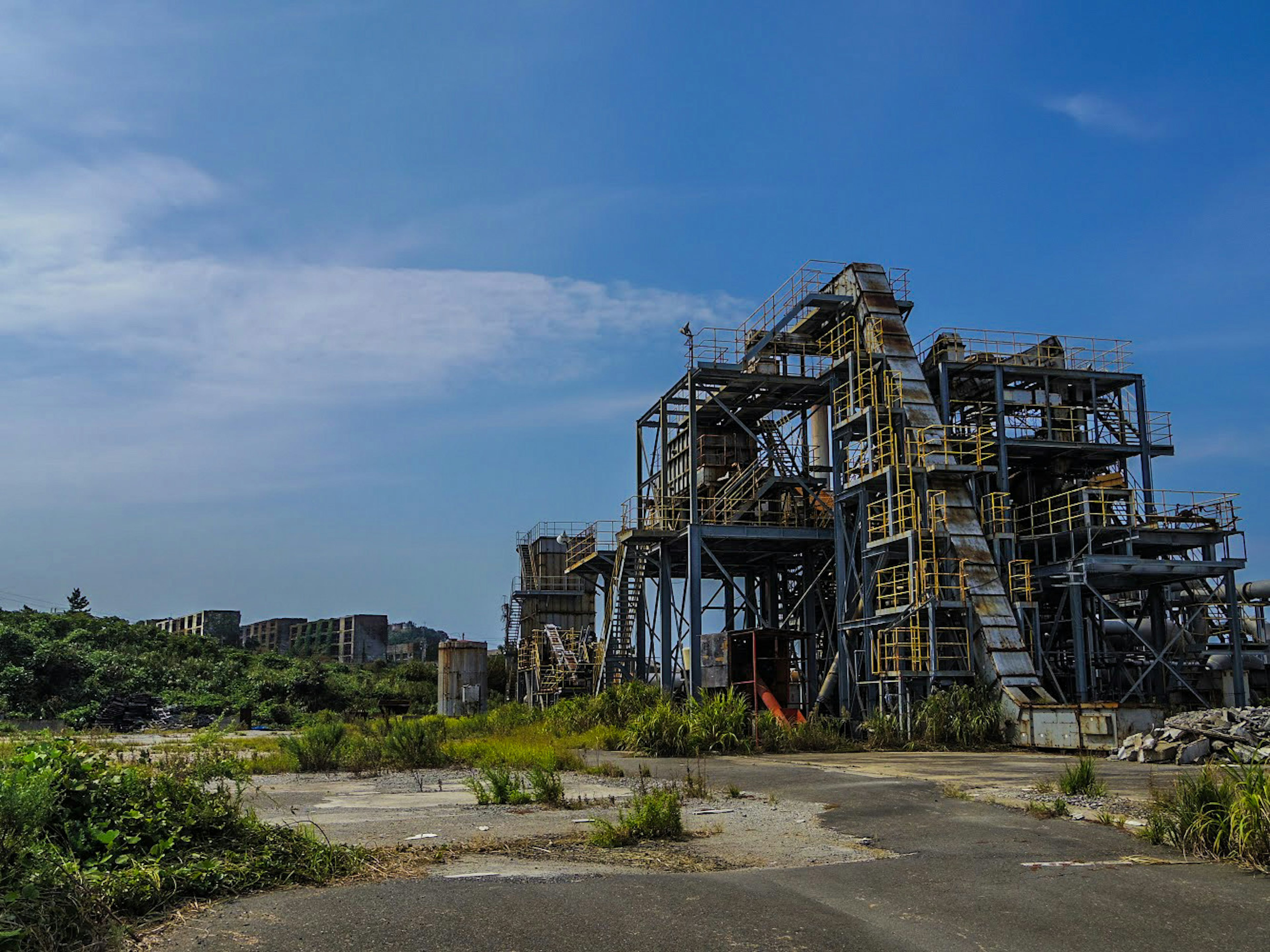 Abandoned industrial structure with blue sky