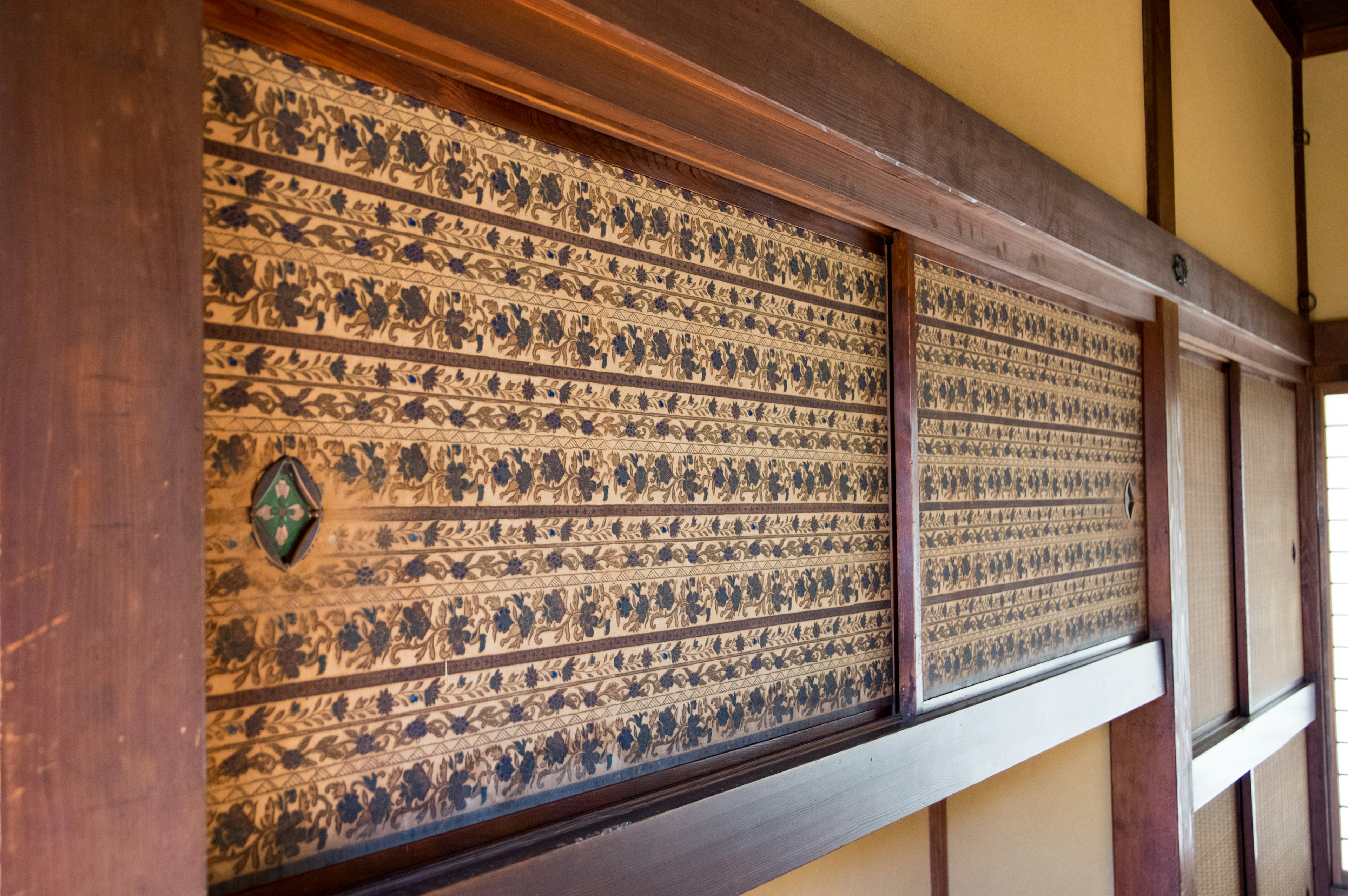 Traditional Japanese wall featuring beautiful patterned shoji