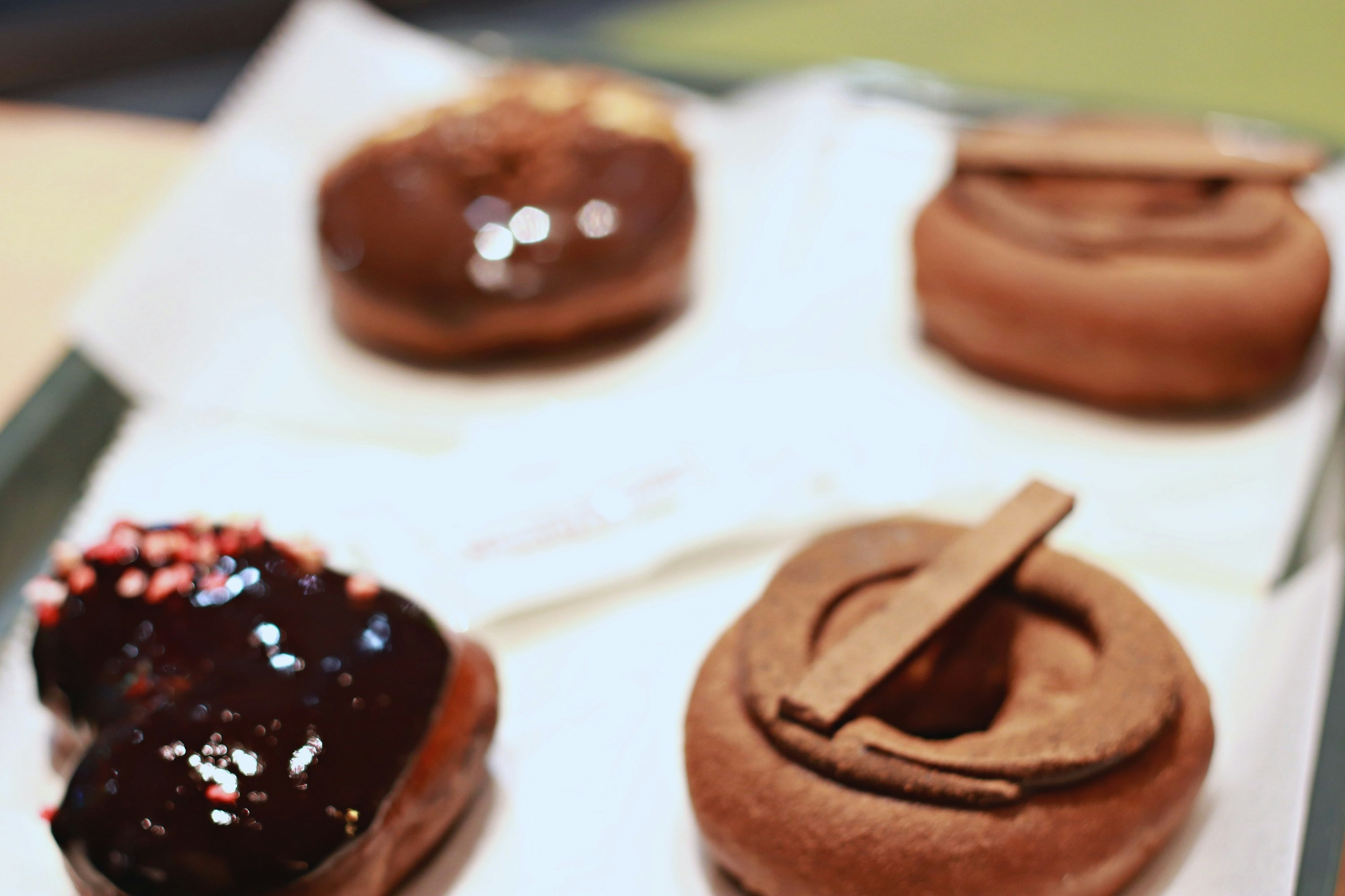 A variety of donuts arranged on a plate