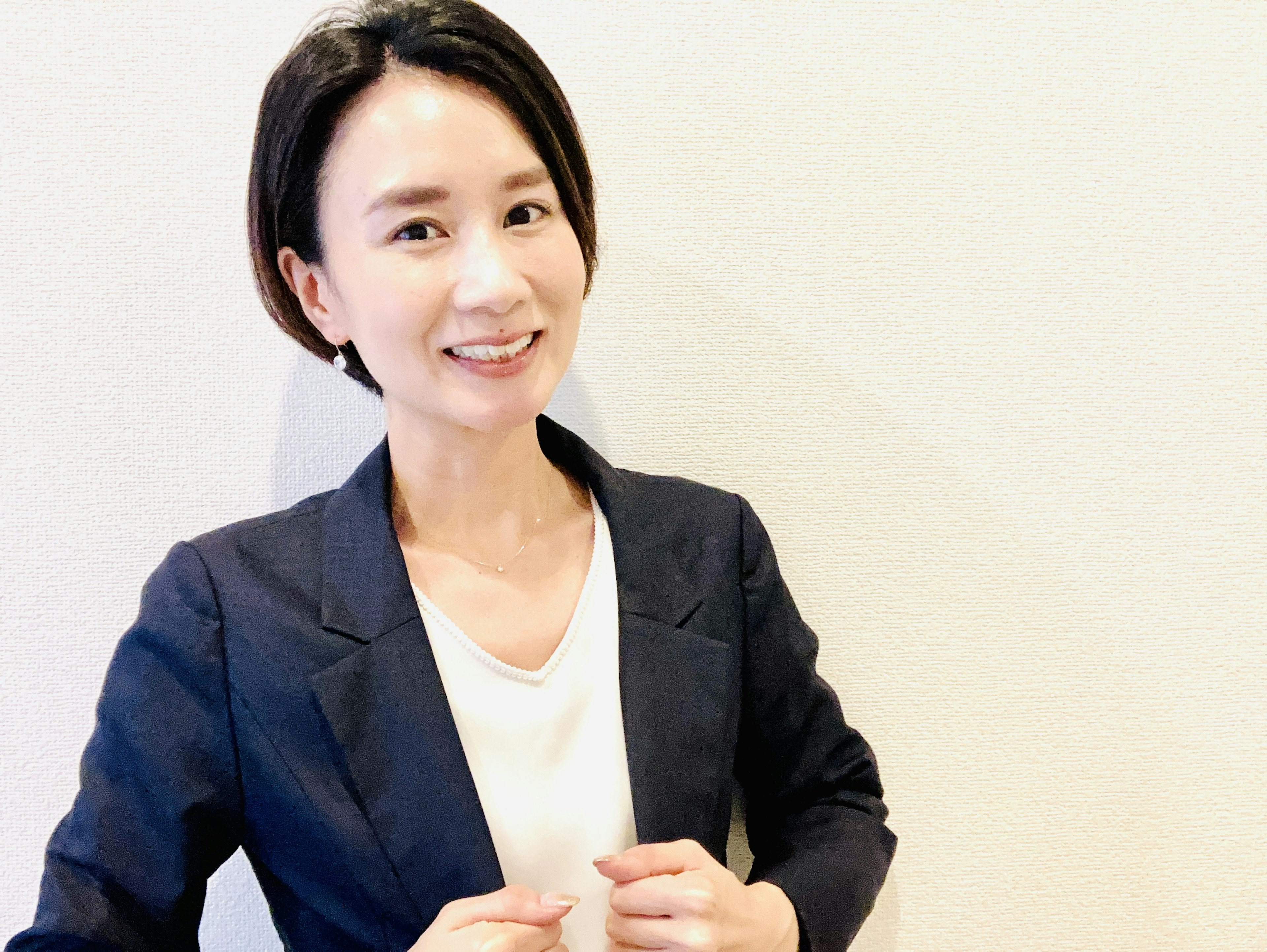 Portrait of a smiling woman in a suit