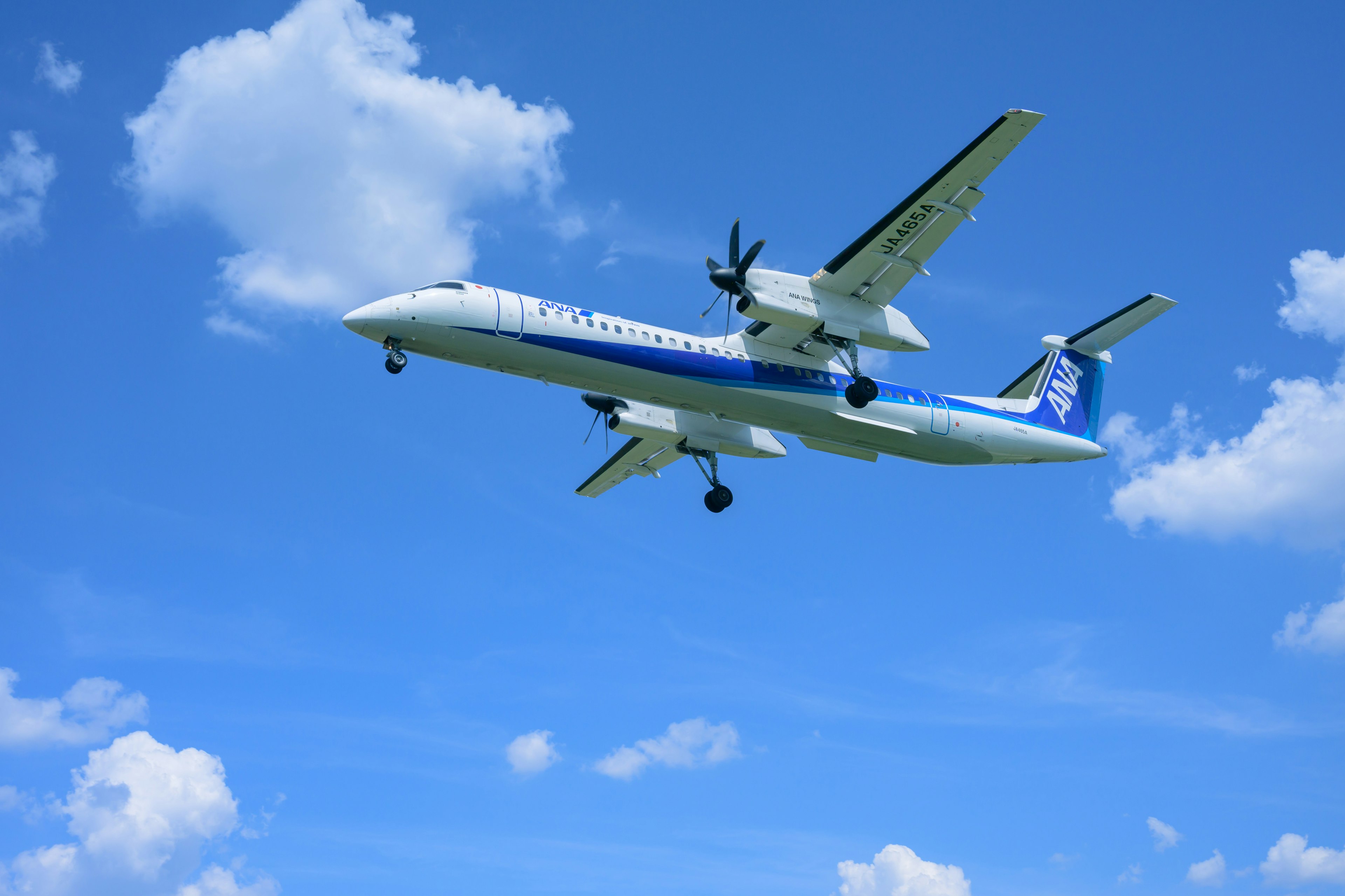 Propeller airplane flying in a clear blue sky