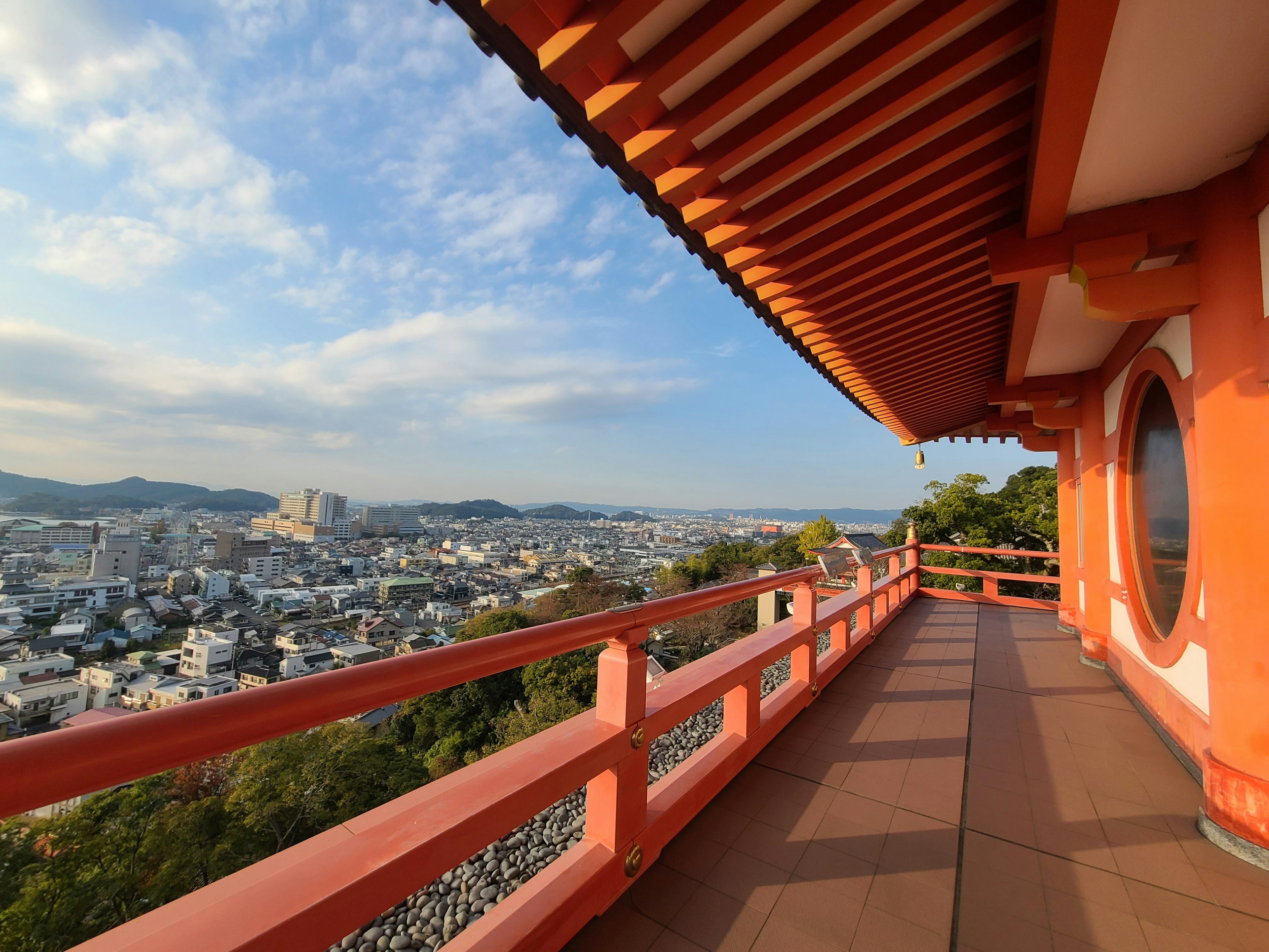 Terrace of an orange building overlooking a beautiful landscape