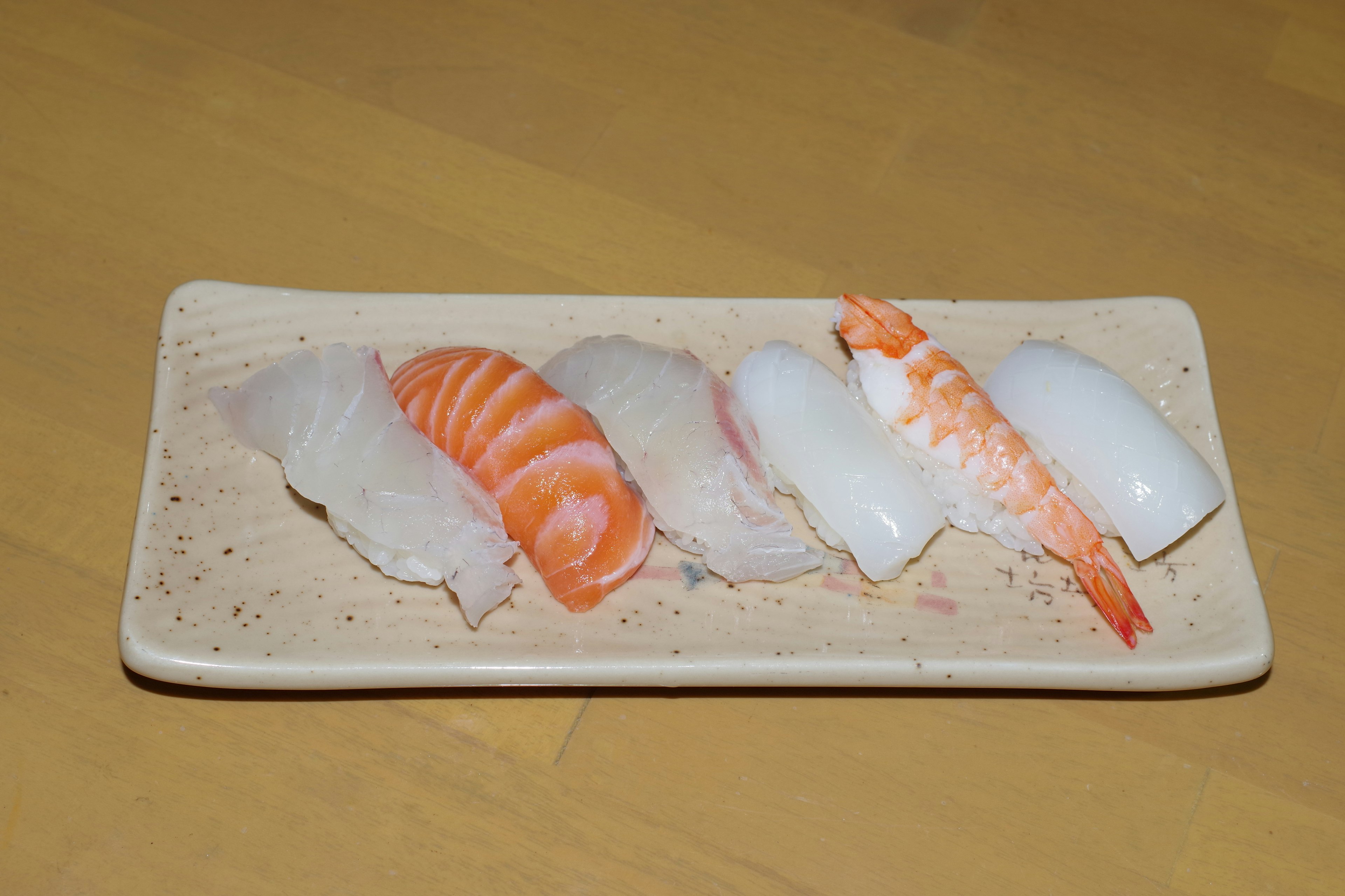 Plate of fresh sushi featuring various seafood