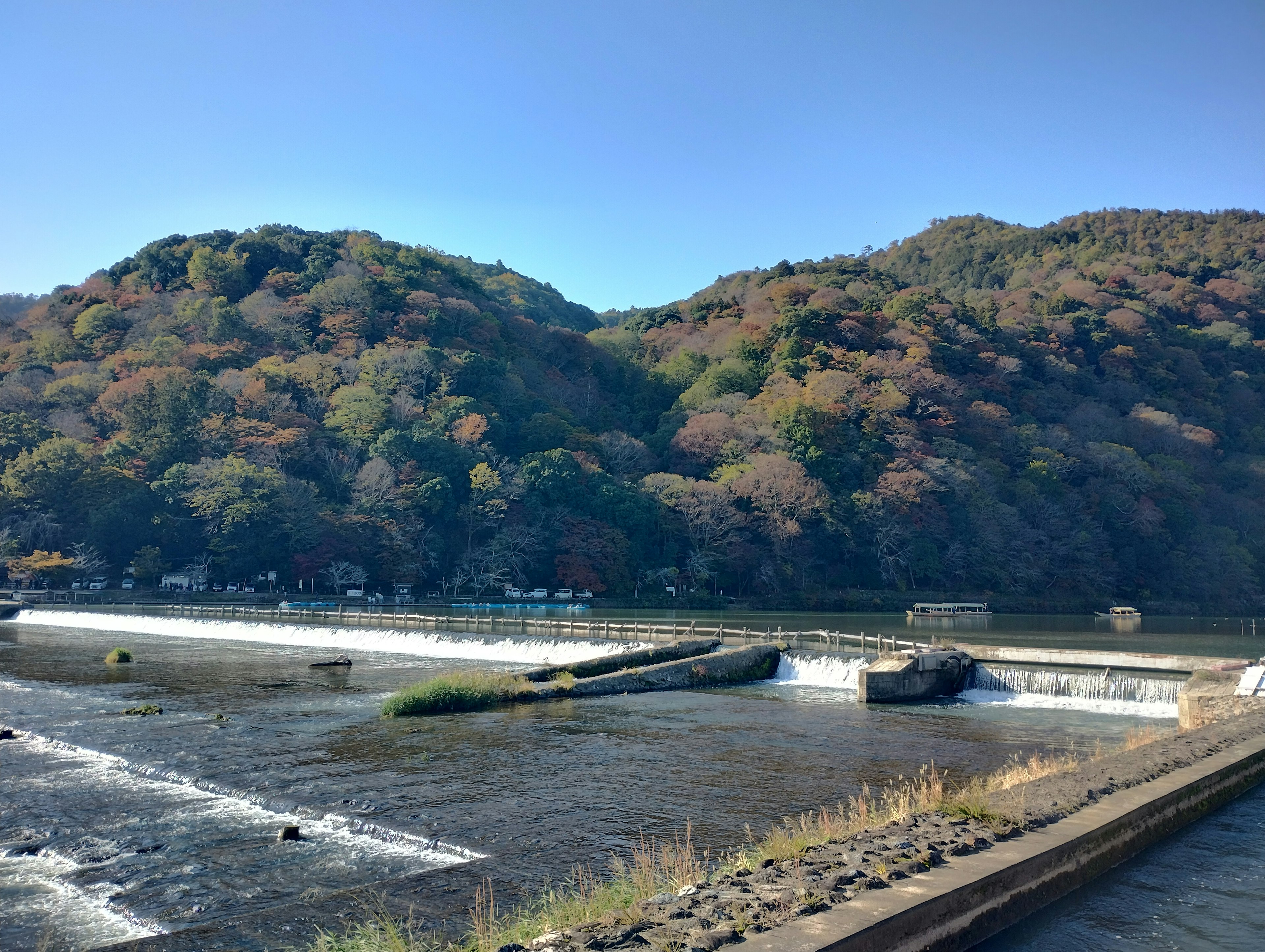 Scenic natural landscape featuring colorful mountains and a calm river flow