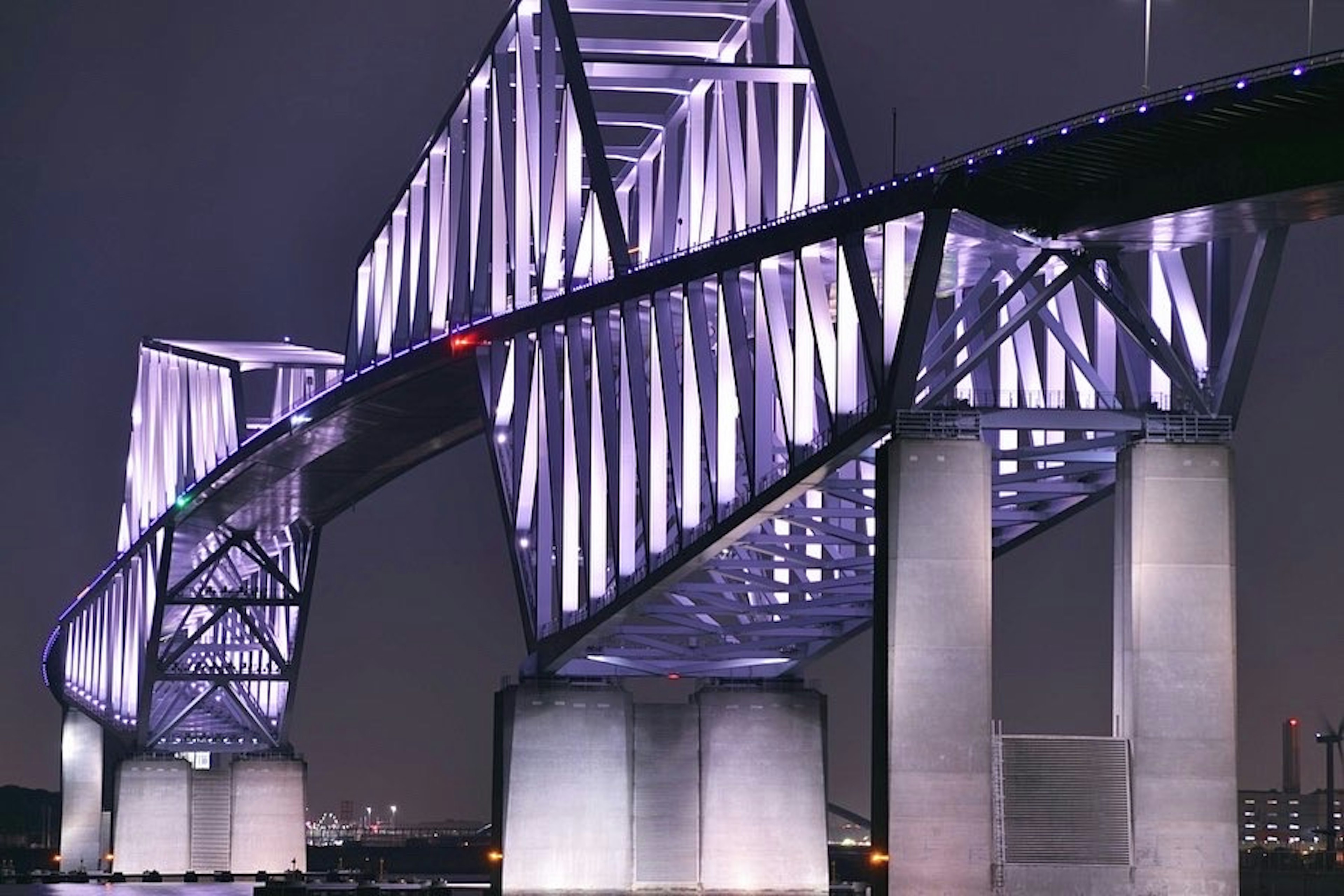 Modern bridge structure illuminated at night