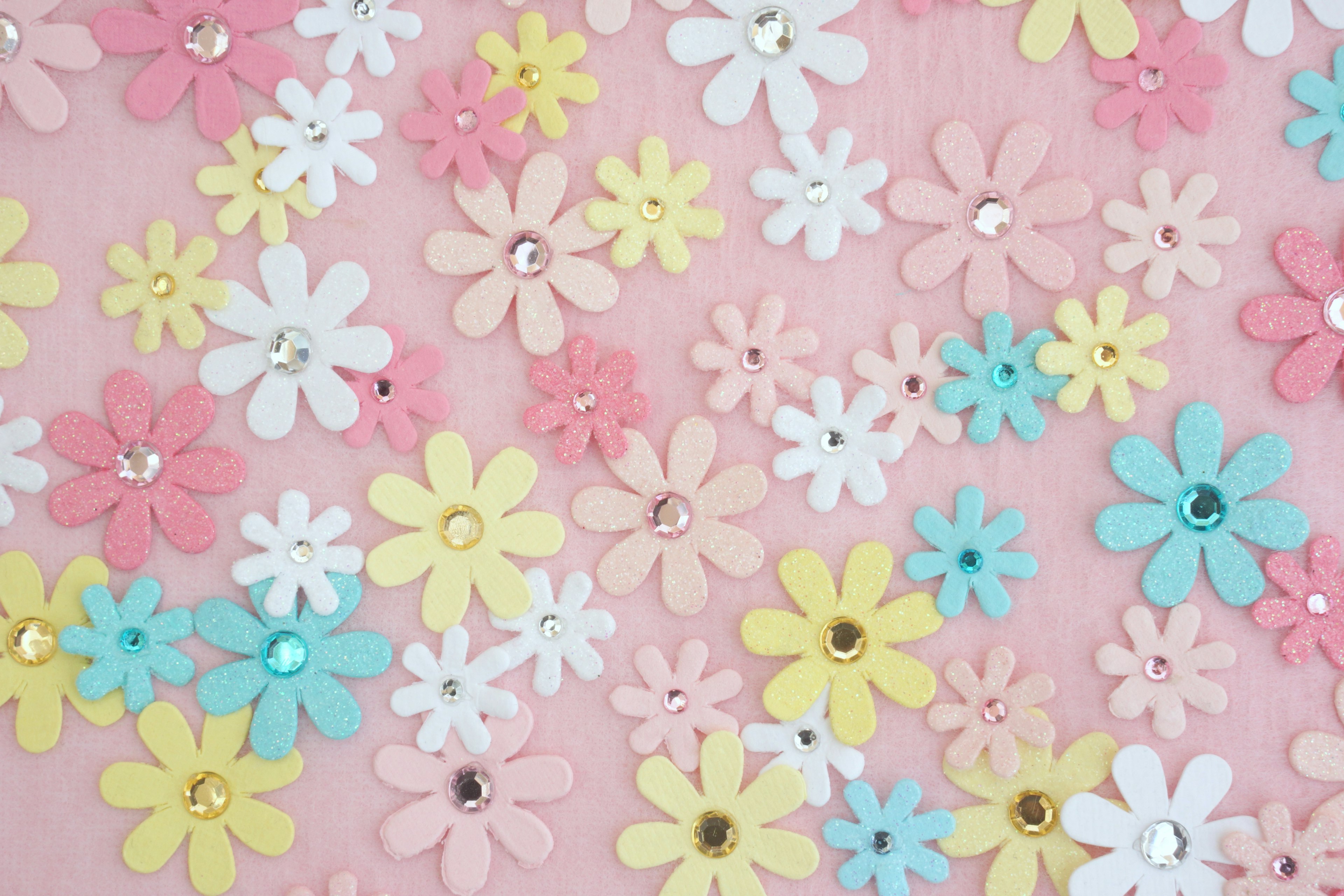 Colorful flower decorations on a pink background