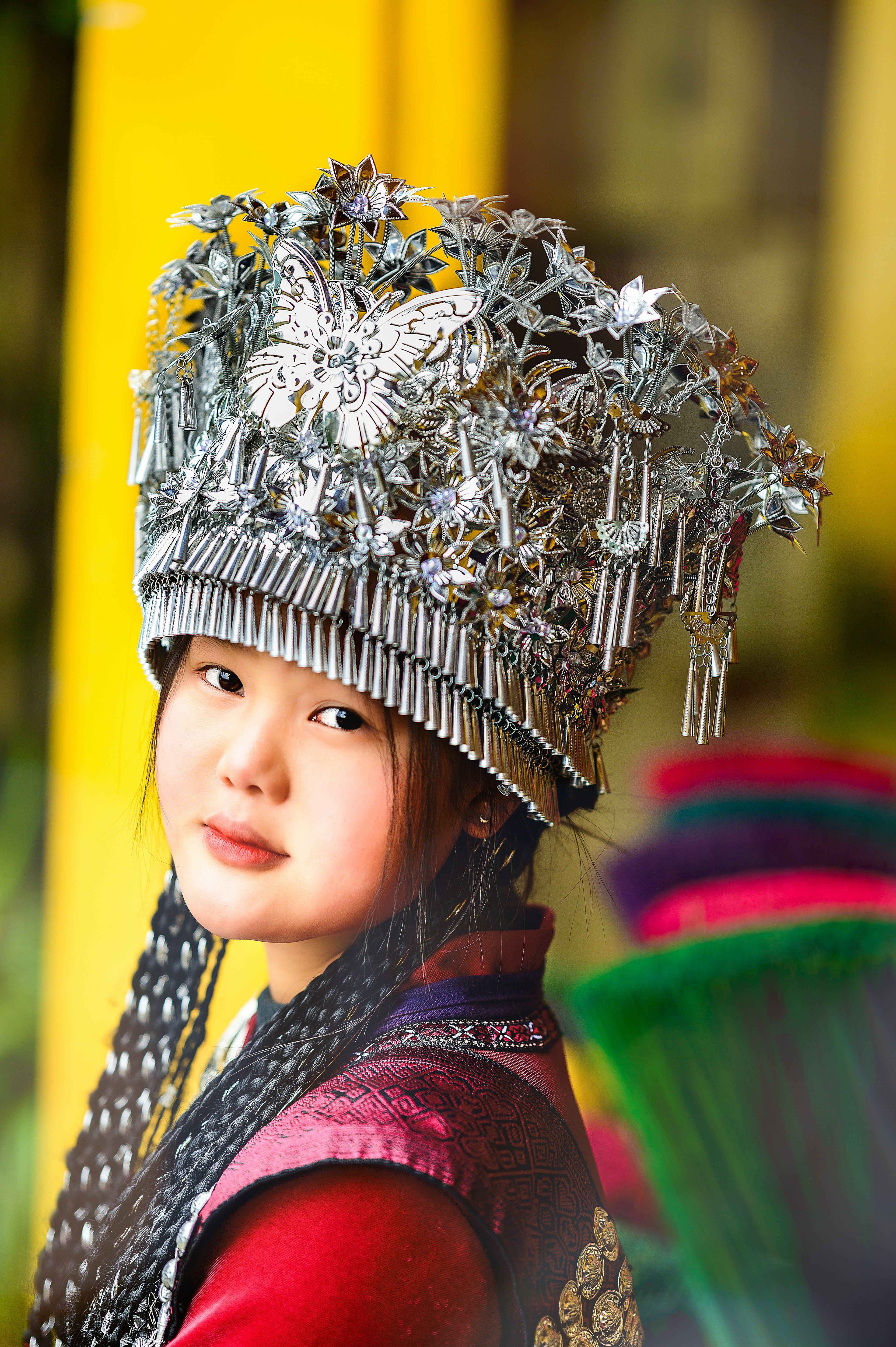 Portrait of a young woman wearing a beautifully adorned silver headdress