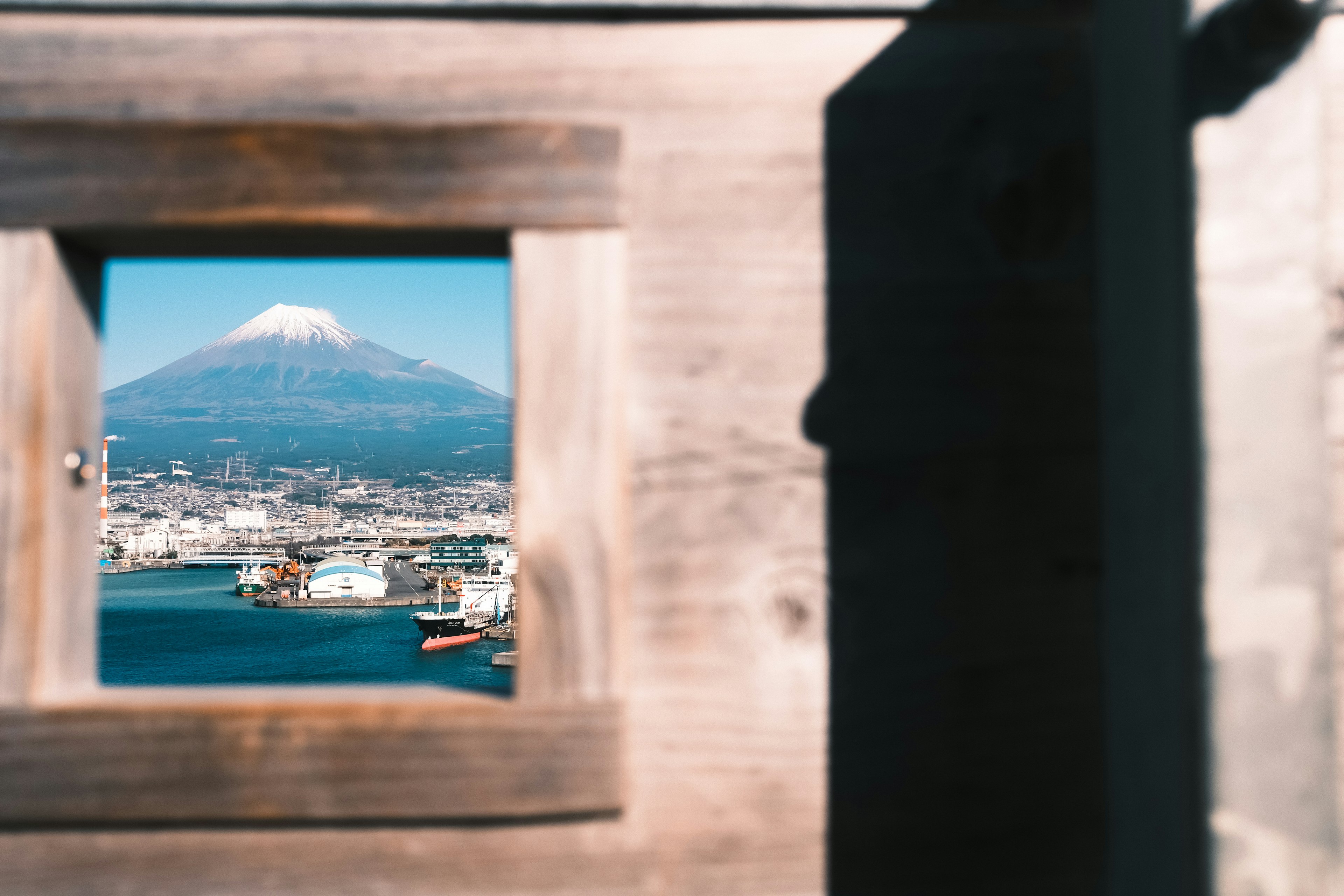 Beautiful view of Mount Fuji through a wooden frame