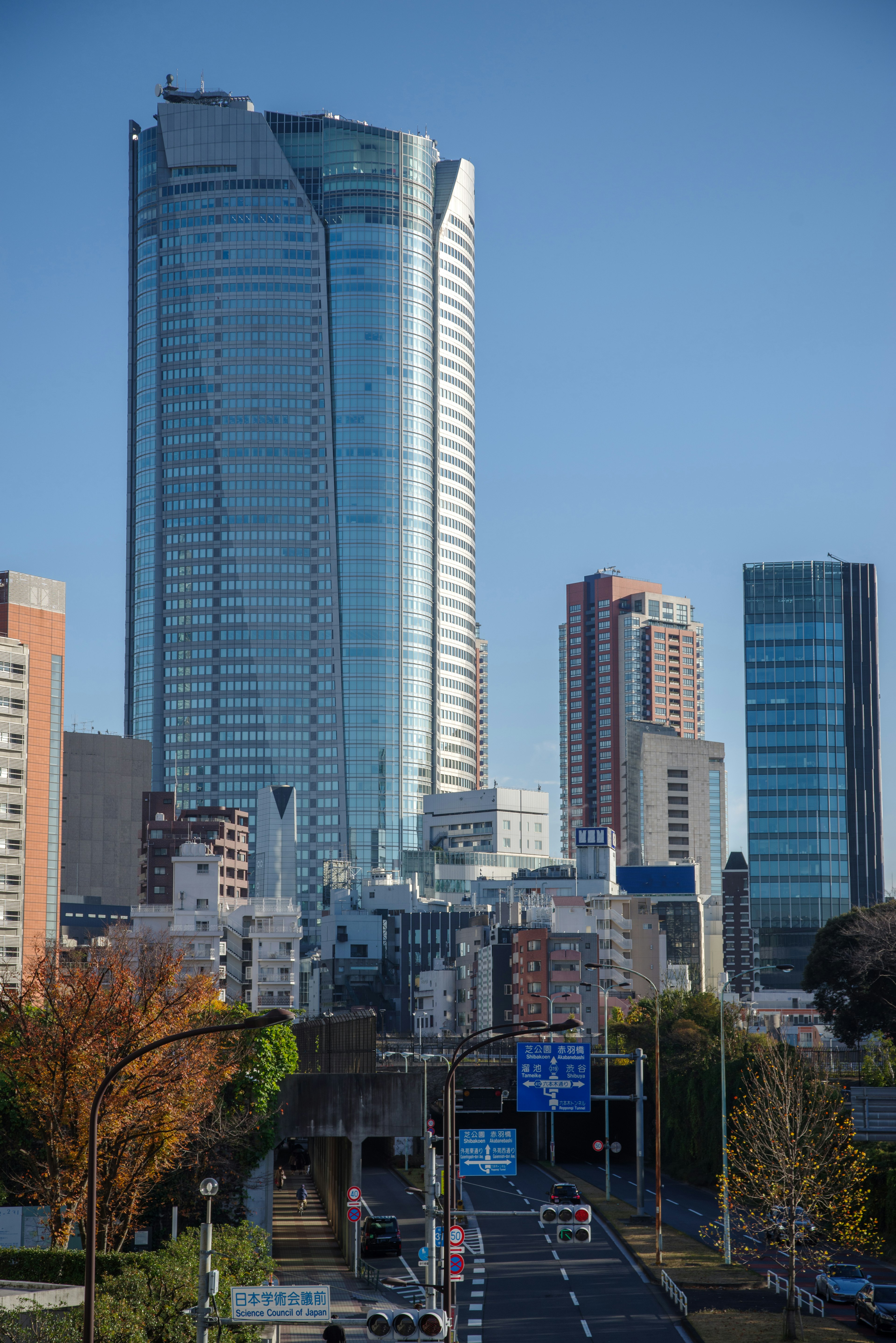 Tokyo cityscape featuring skyscrapers and a clear blue sky