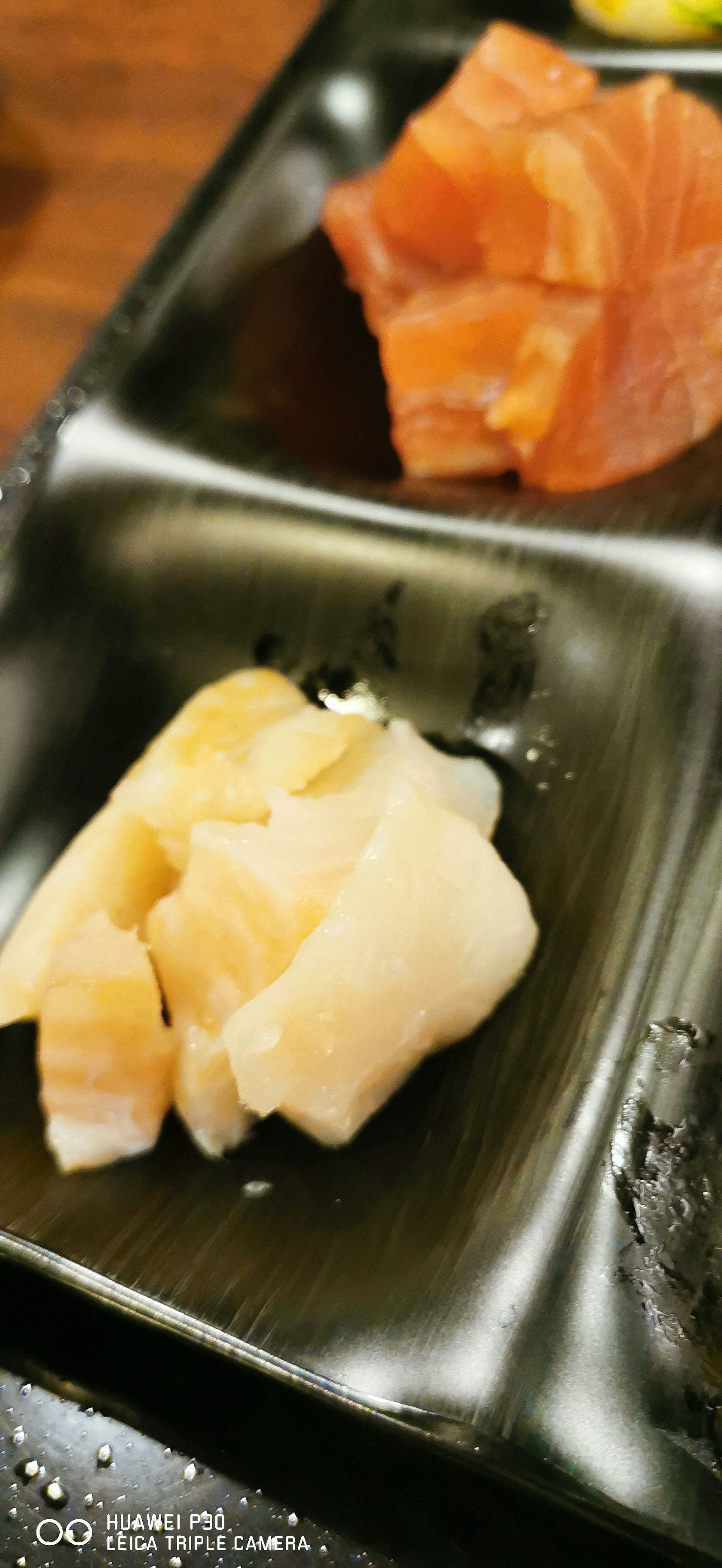 Plate of sushi featuring salmon and white fish