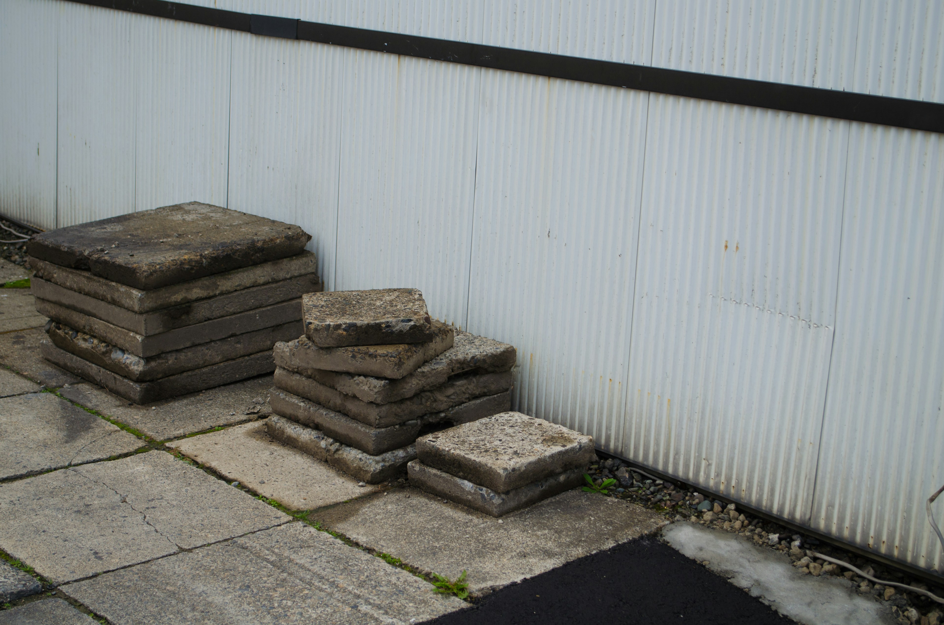 Stacked concrete blocks near a wall