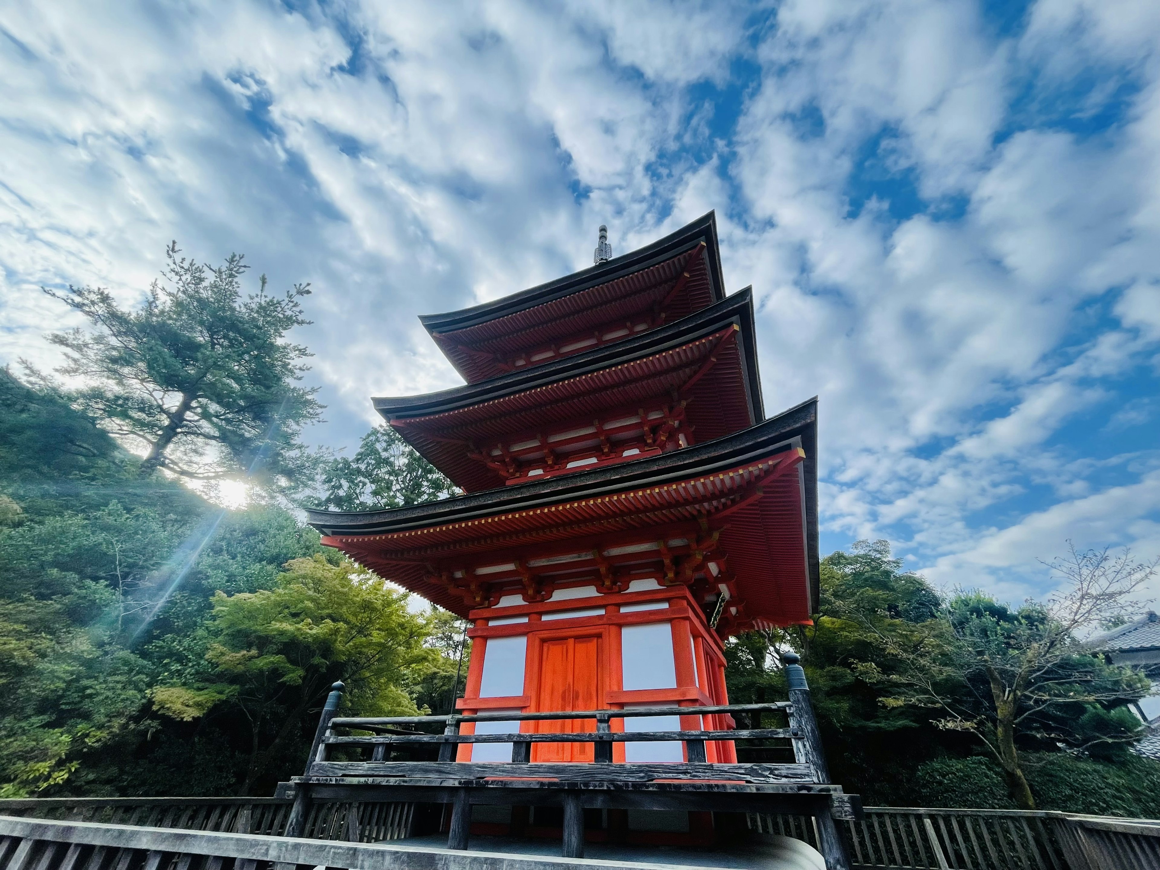 Red five-story pagoda against a blue sky