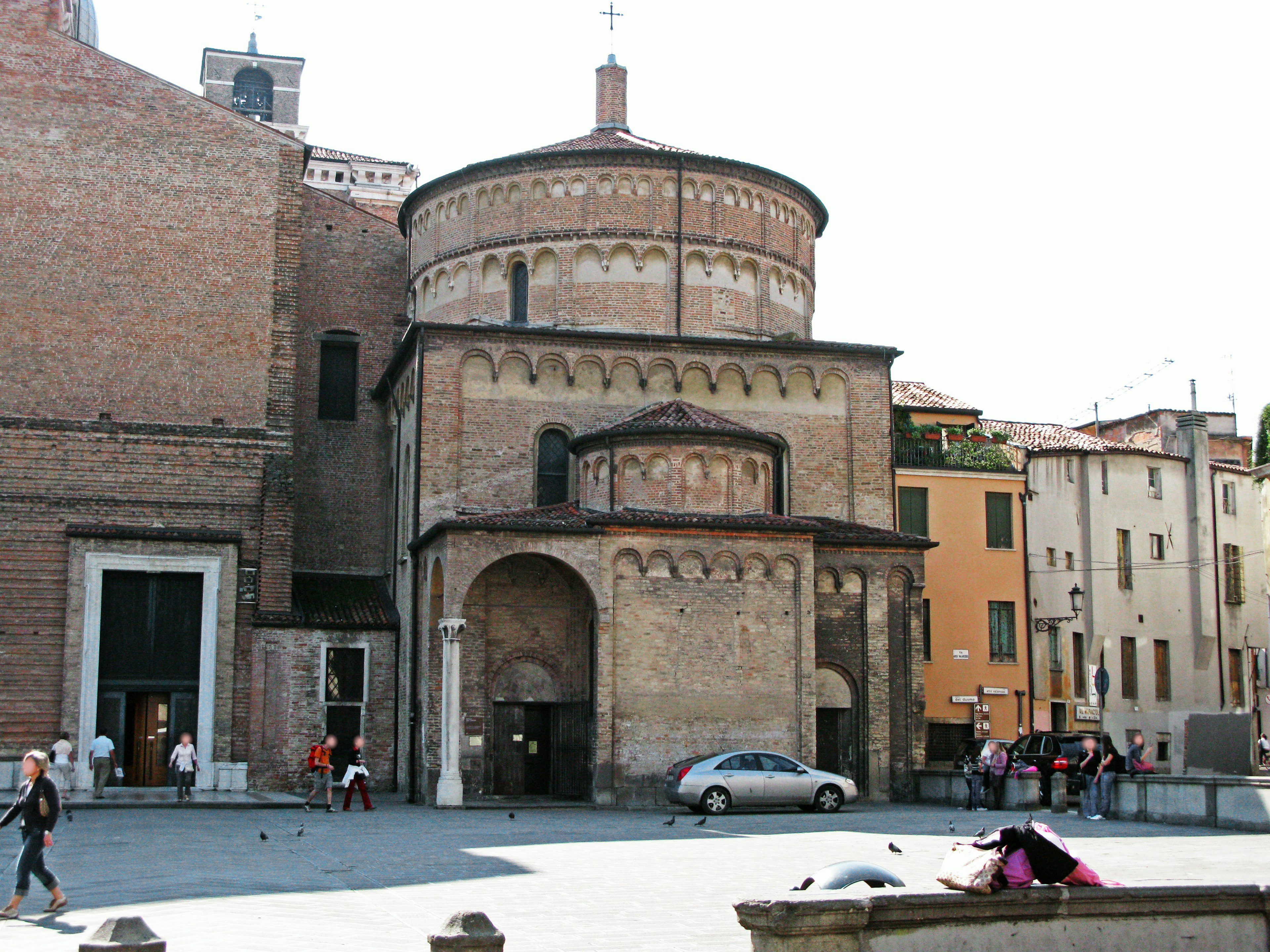 Historic church exterior with surrounding buildings in a square