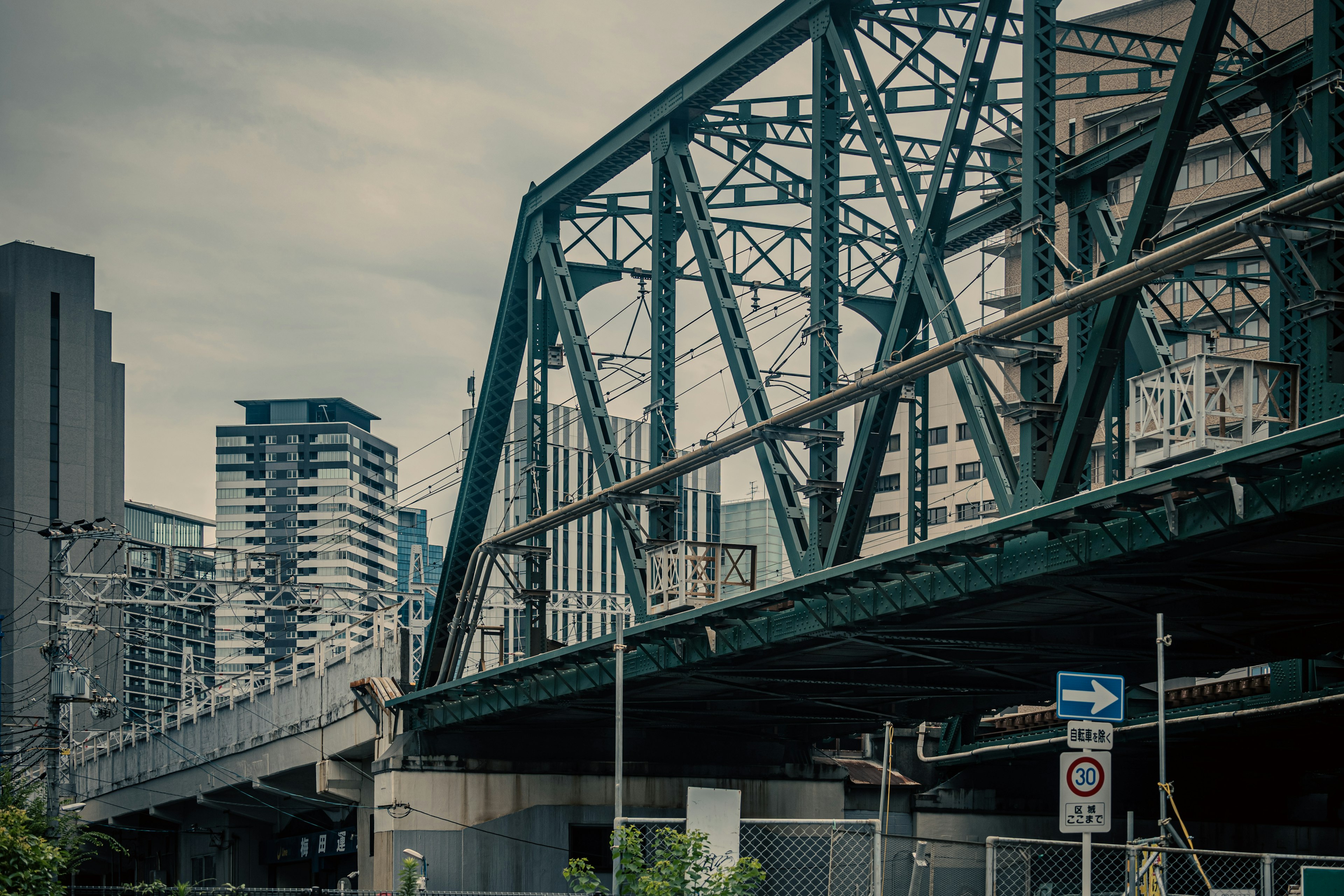 Urban steel bridge with skyscrapers in the background