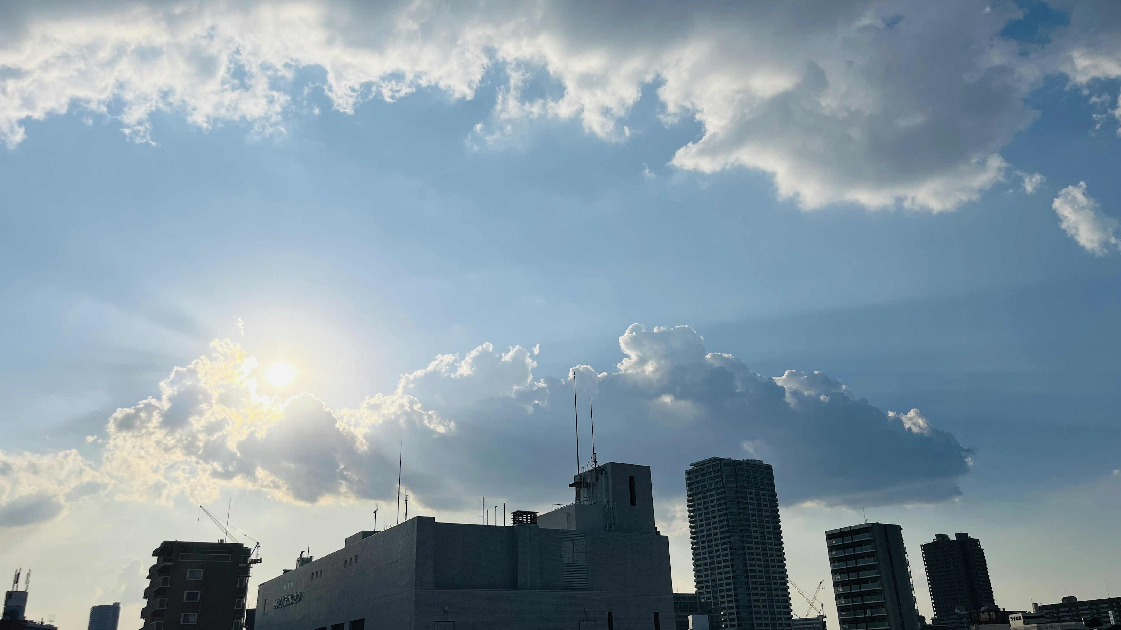 Sky with clouds and sunlight shining through