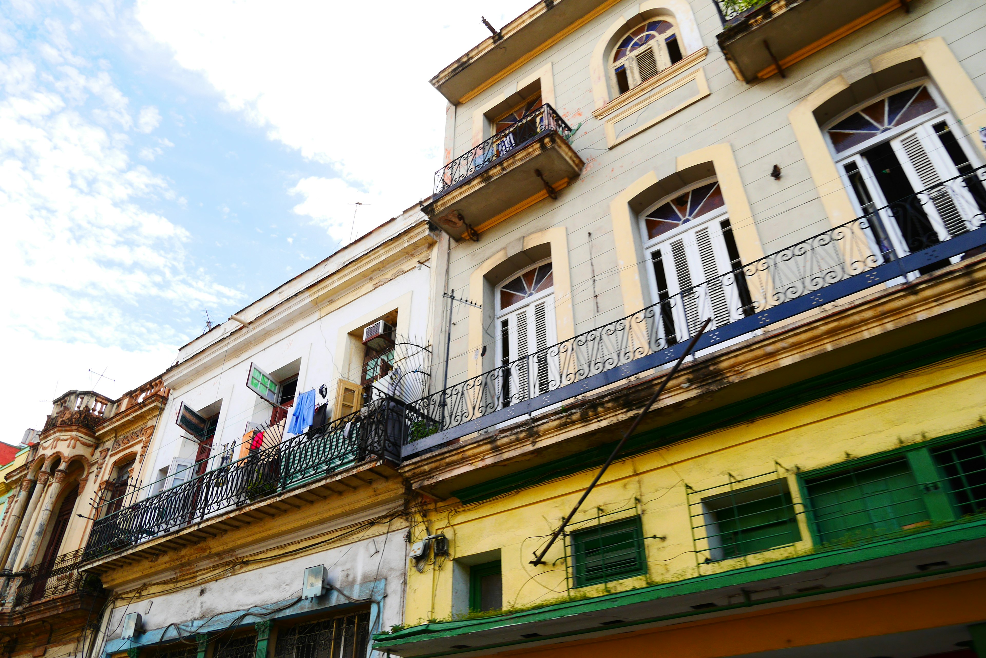 Facade of an old building with colorful balconies