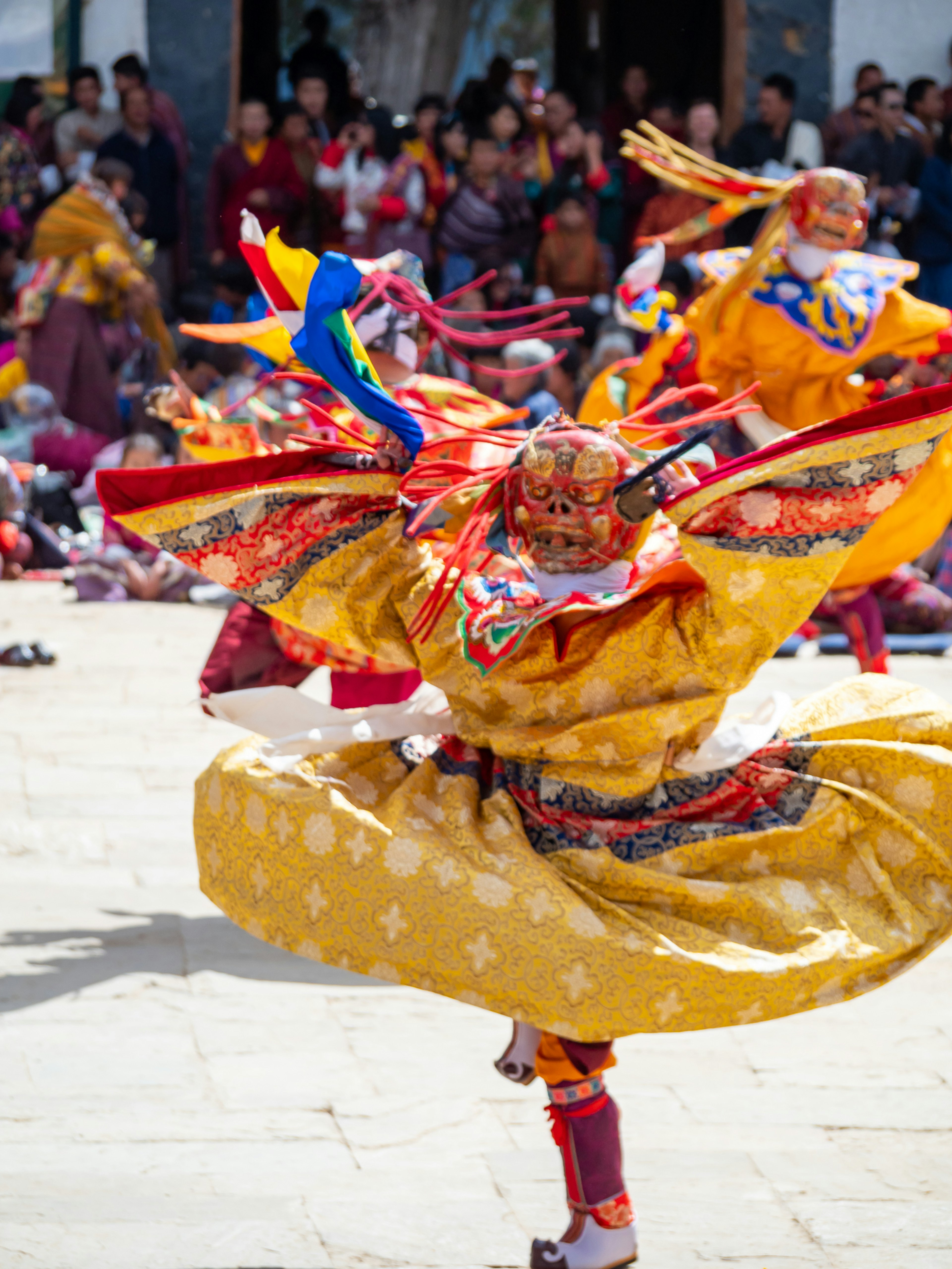 Dancers in colorful traditional costumes performing a vibrant dance