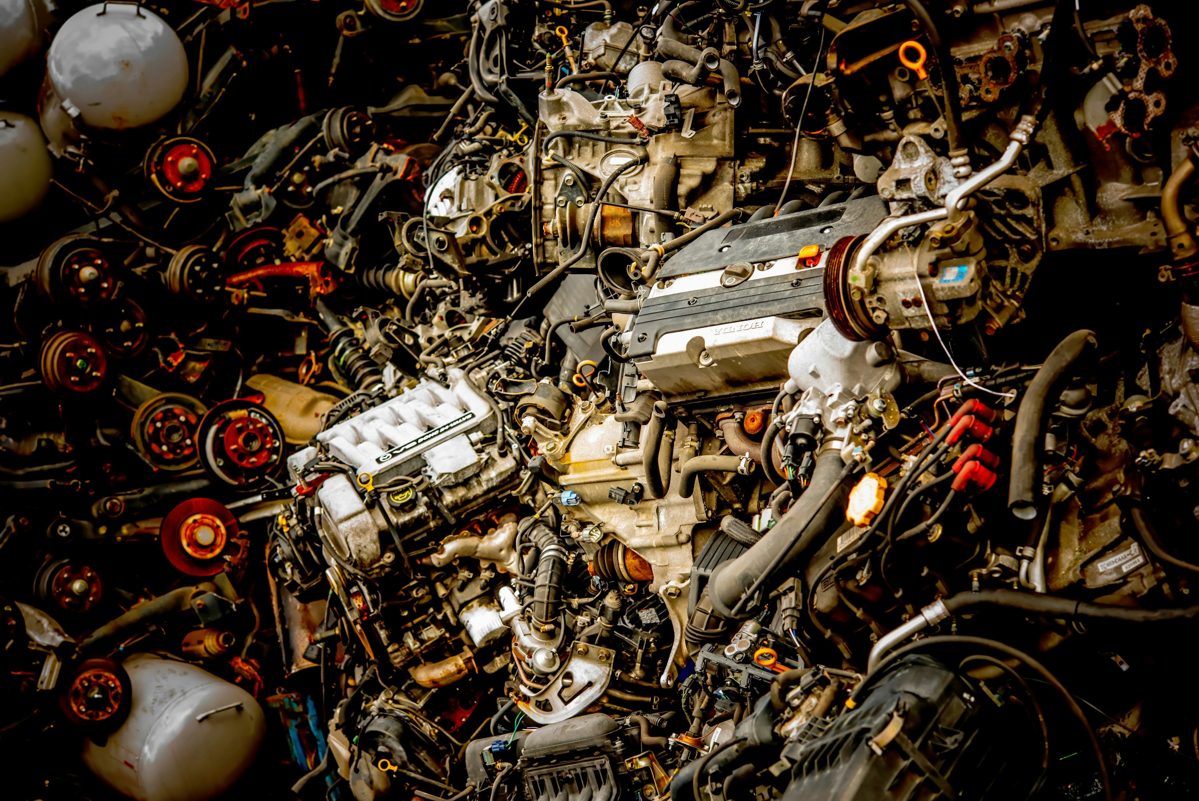 A dense collection of discarded engines and mechanical parts