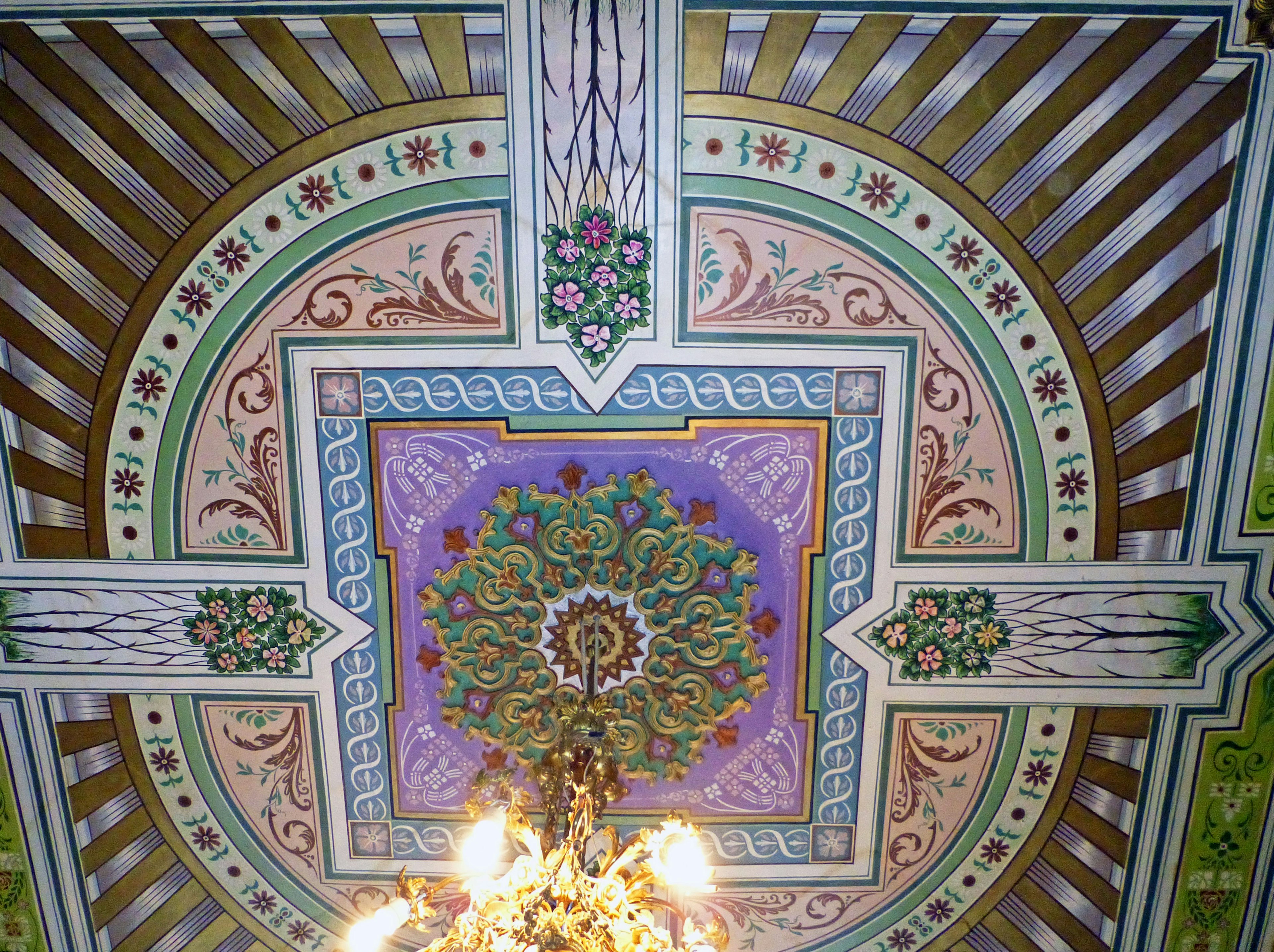 Elaborate ceiling design featuring vibrant colors and intricate patterns