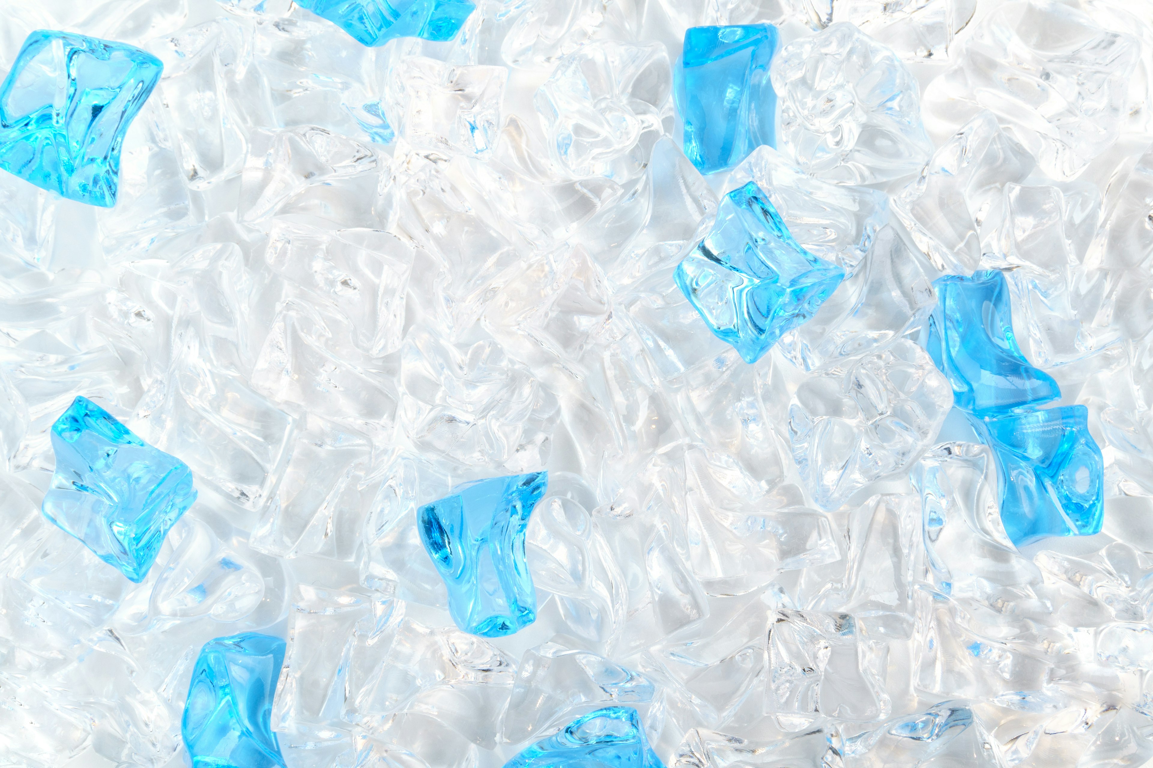 Image featuring scattered blue ice pieces on a transparent background