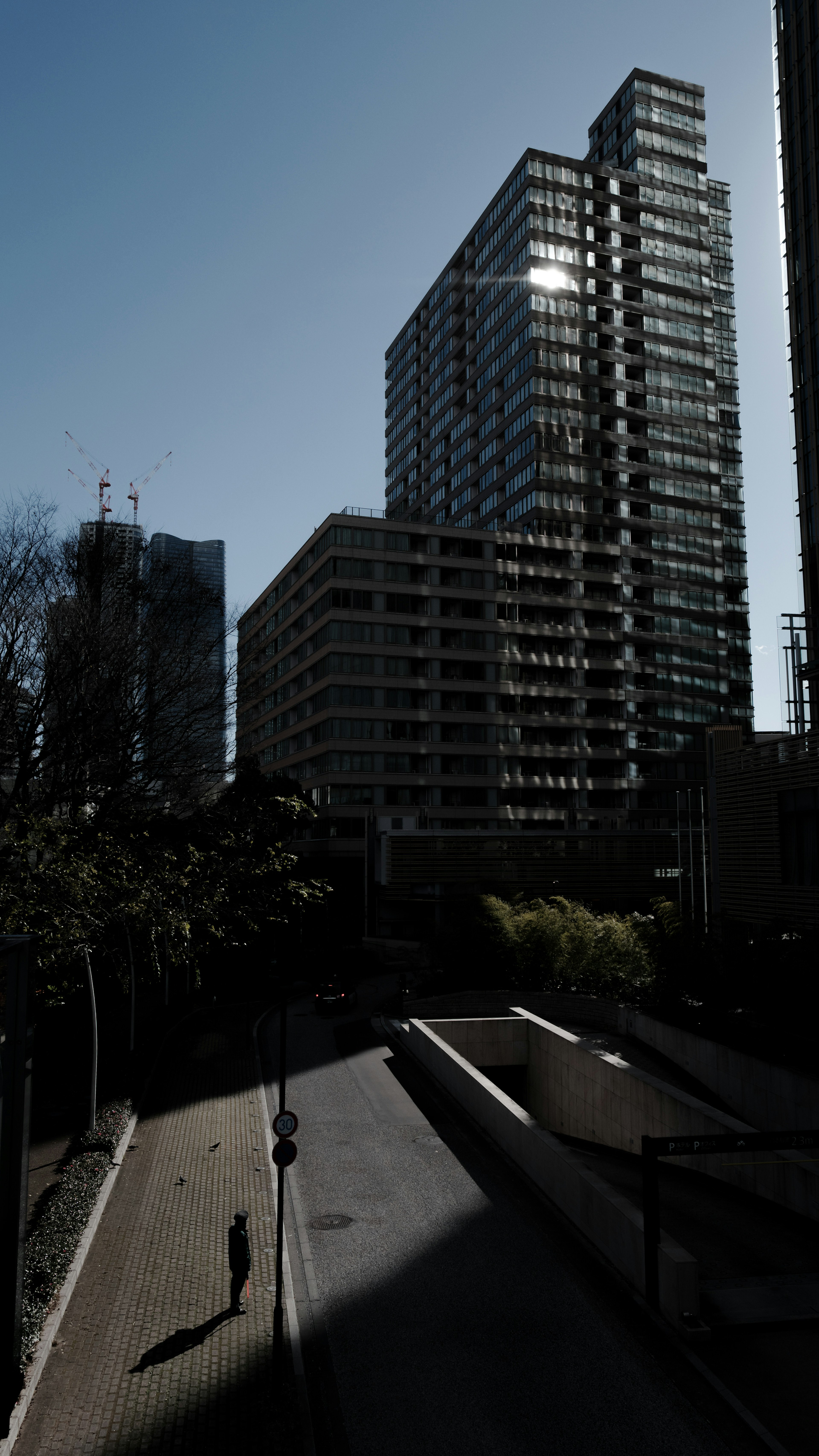 Cityscape featuring tall buildings against a clear blue sky