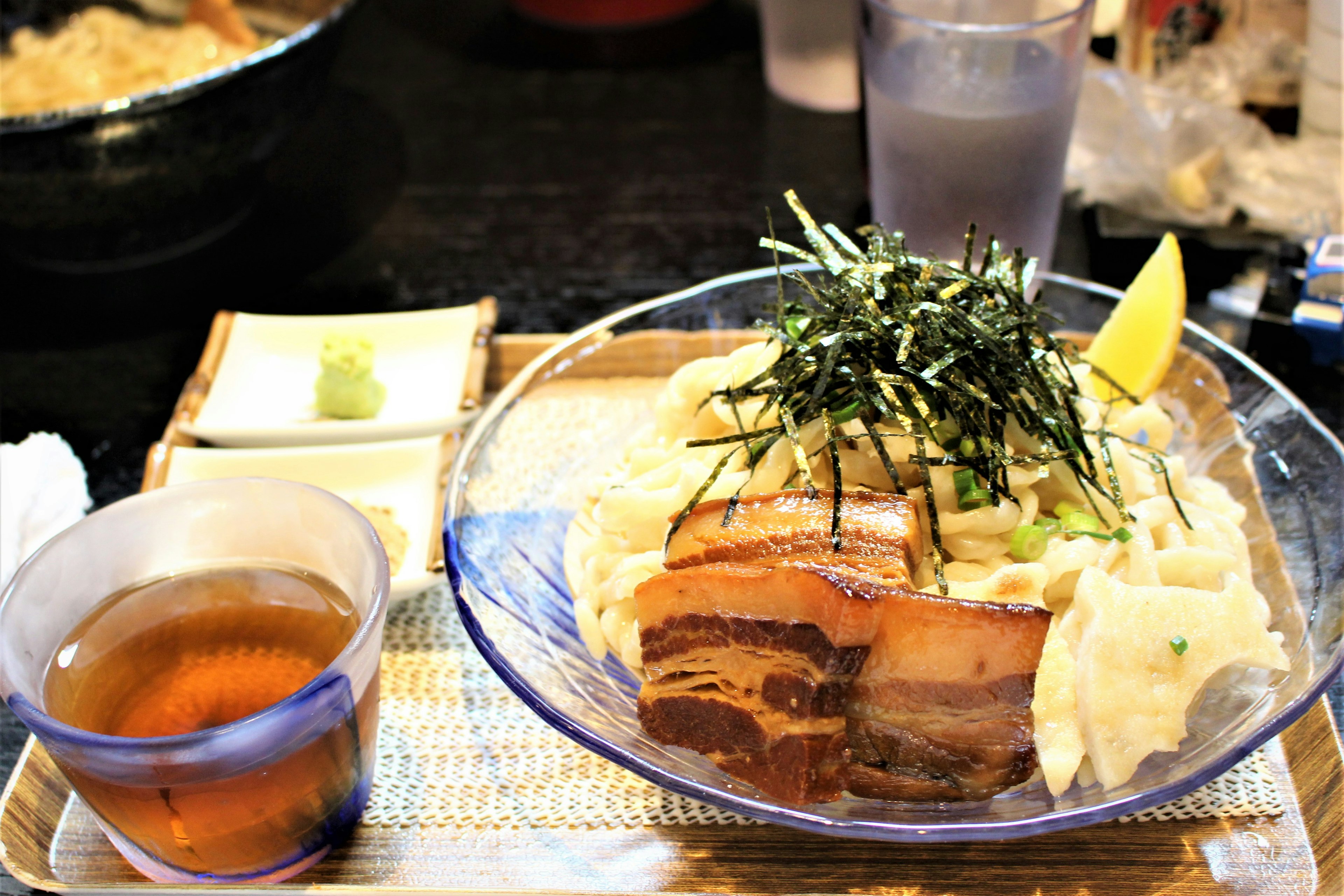 Delicious ramen served with braised pork belly and garnished with seaweed