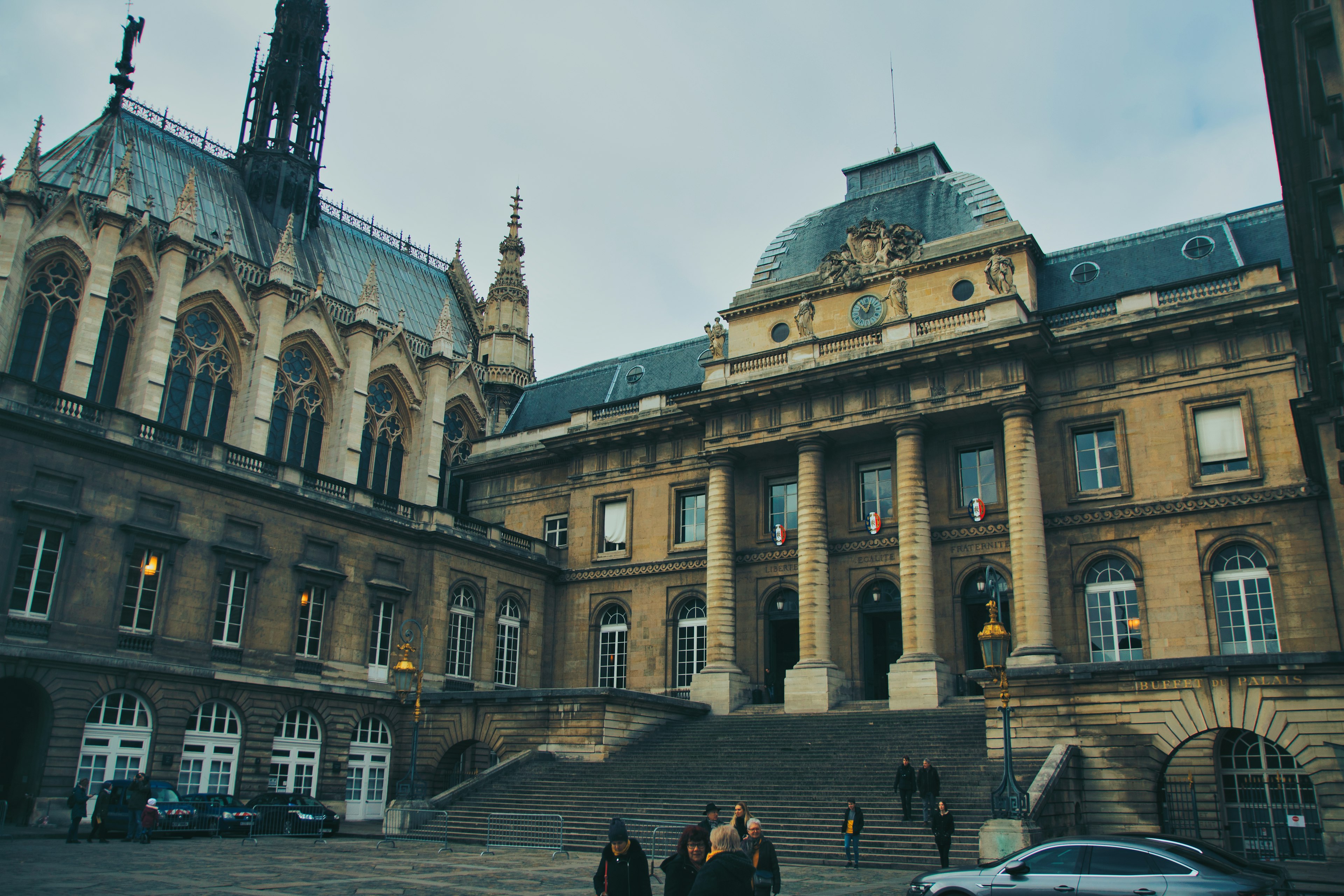 Historic building in France with people walking up the stairs