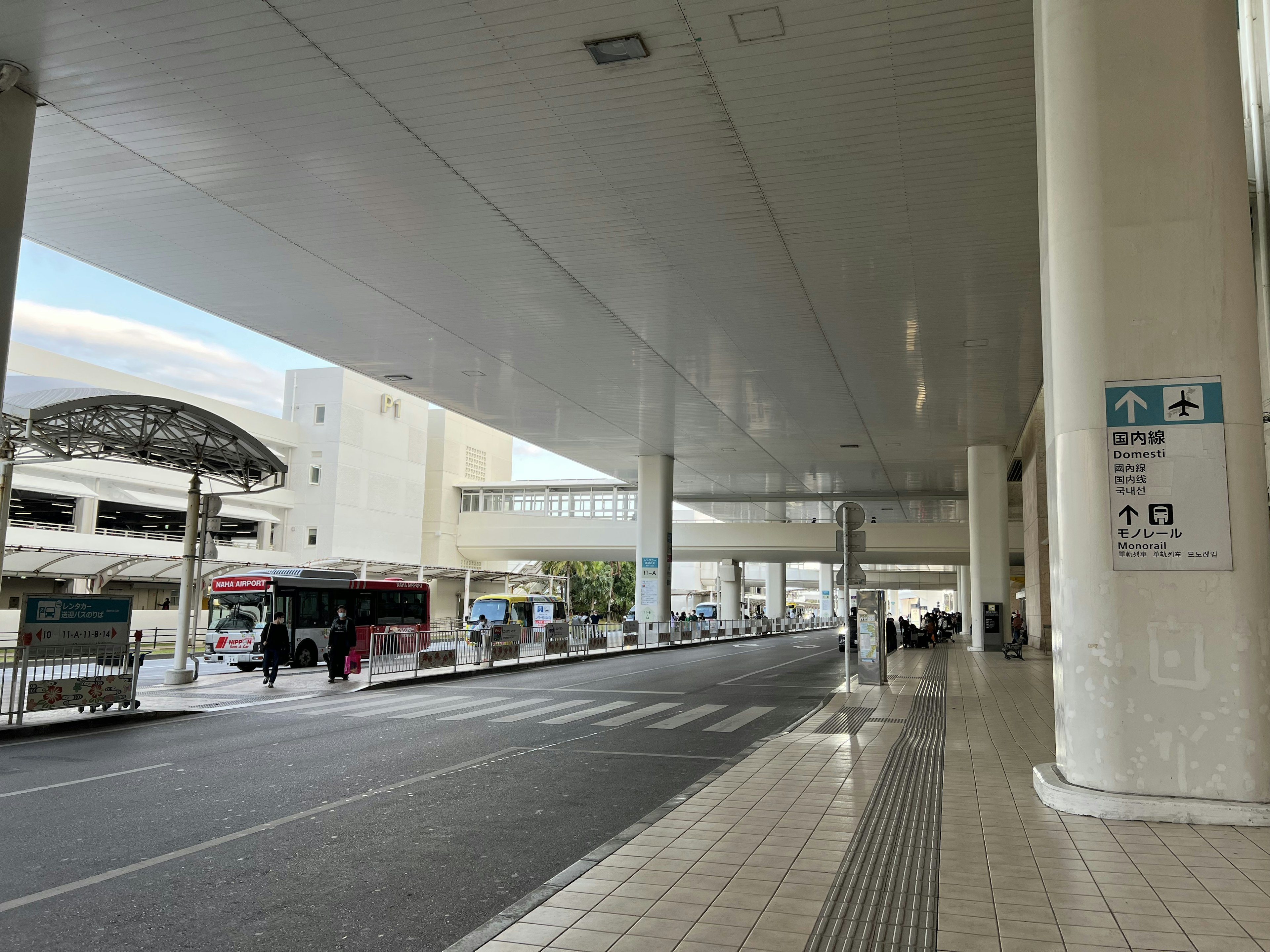 Spacious bus terminal interior with high ceiling structure