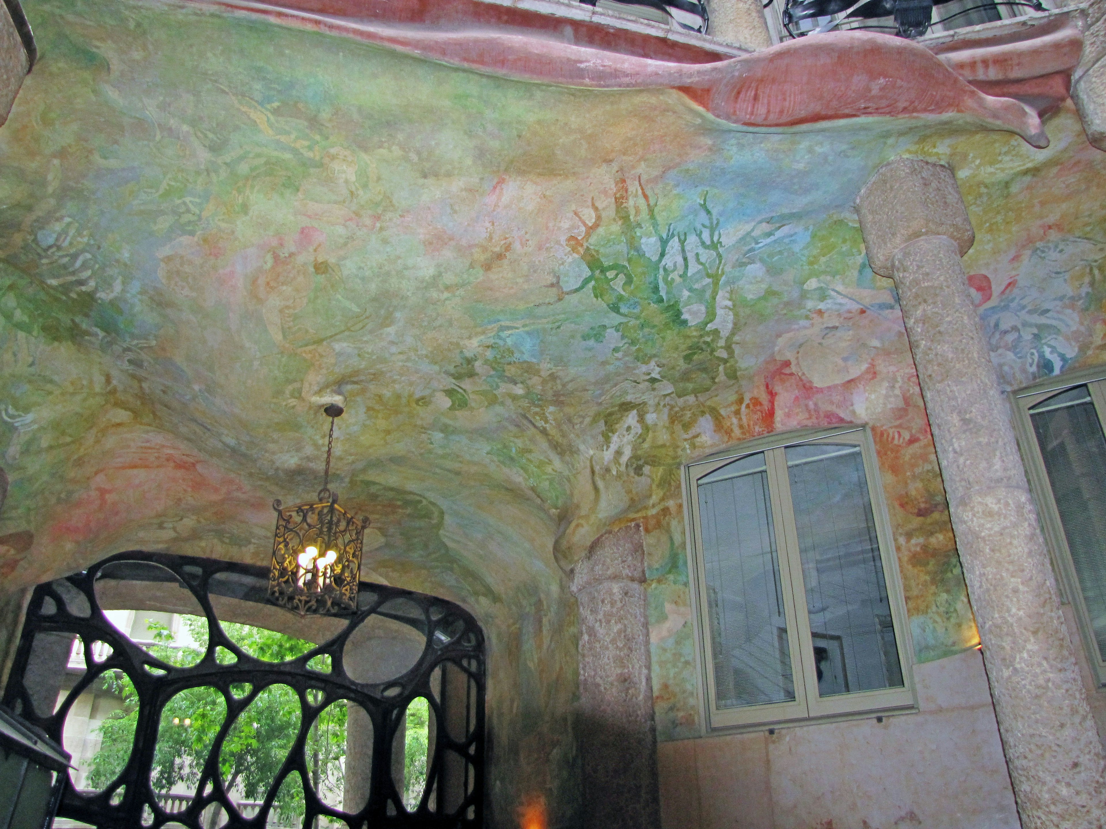 Colorful ceiling and unique column design of Casa Batlló