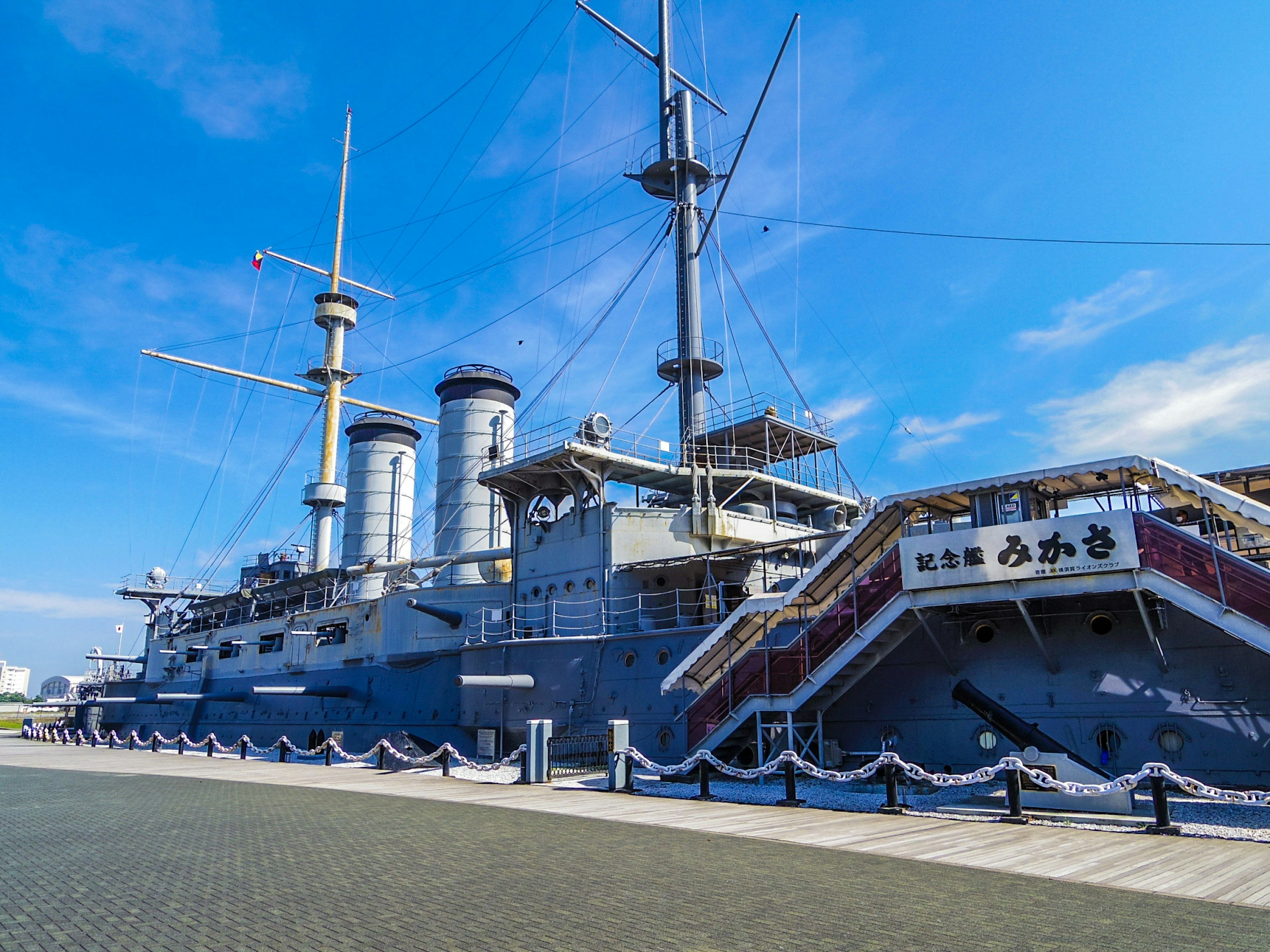 Historic battleship under a blue sky