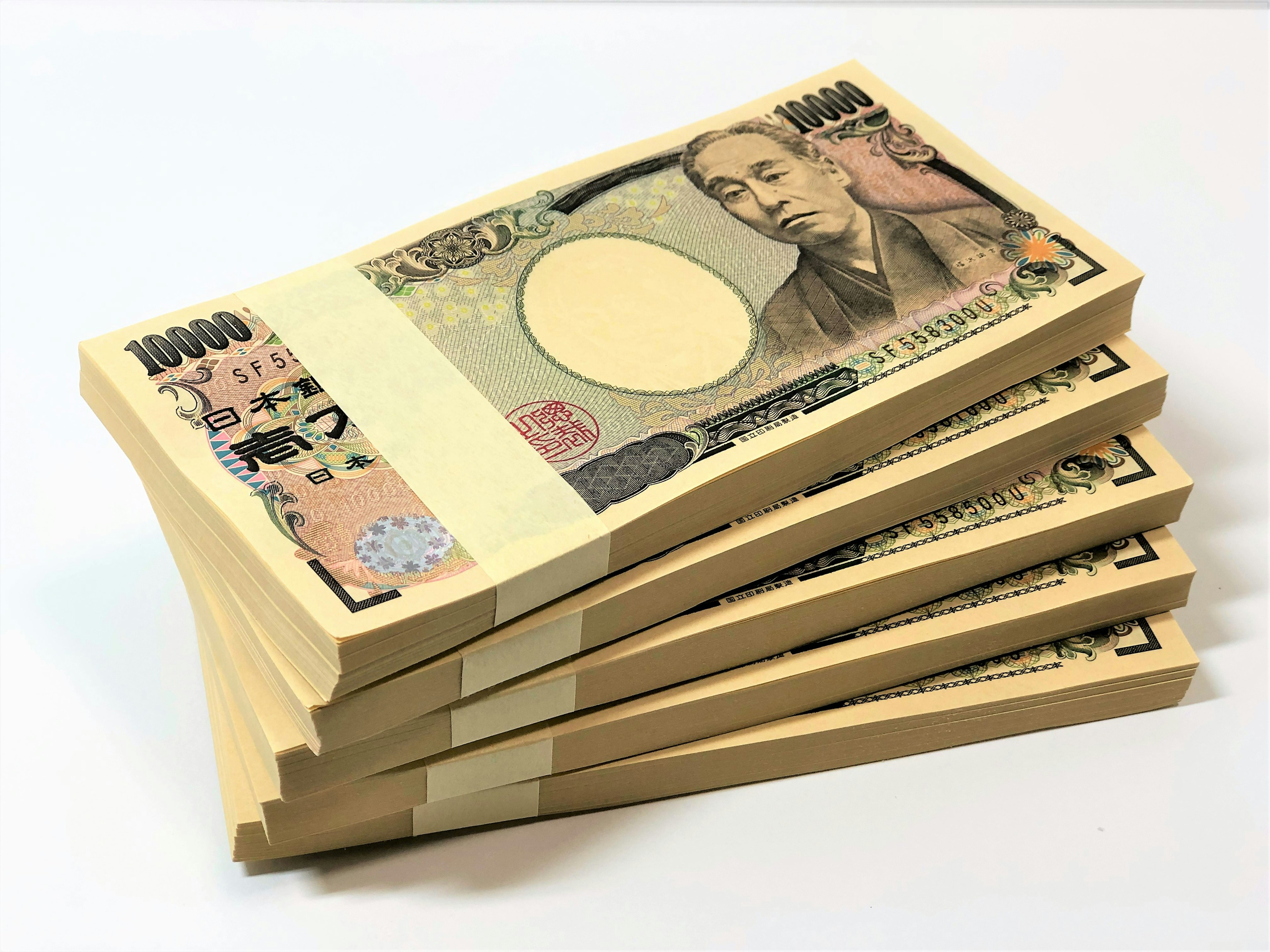 Tumpukan uang kertas 1000 yen Jepang yang tertata rapi