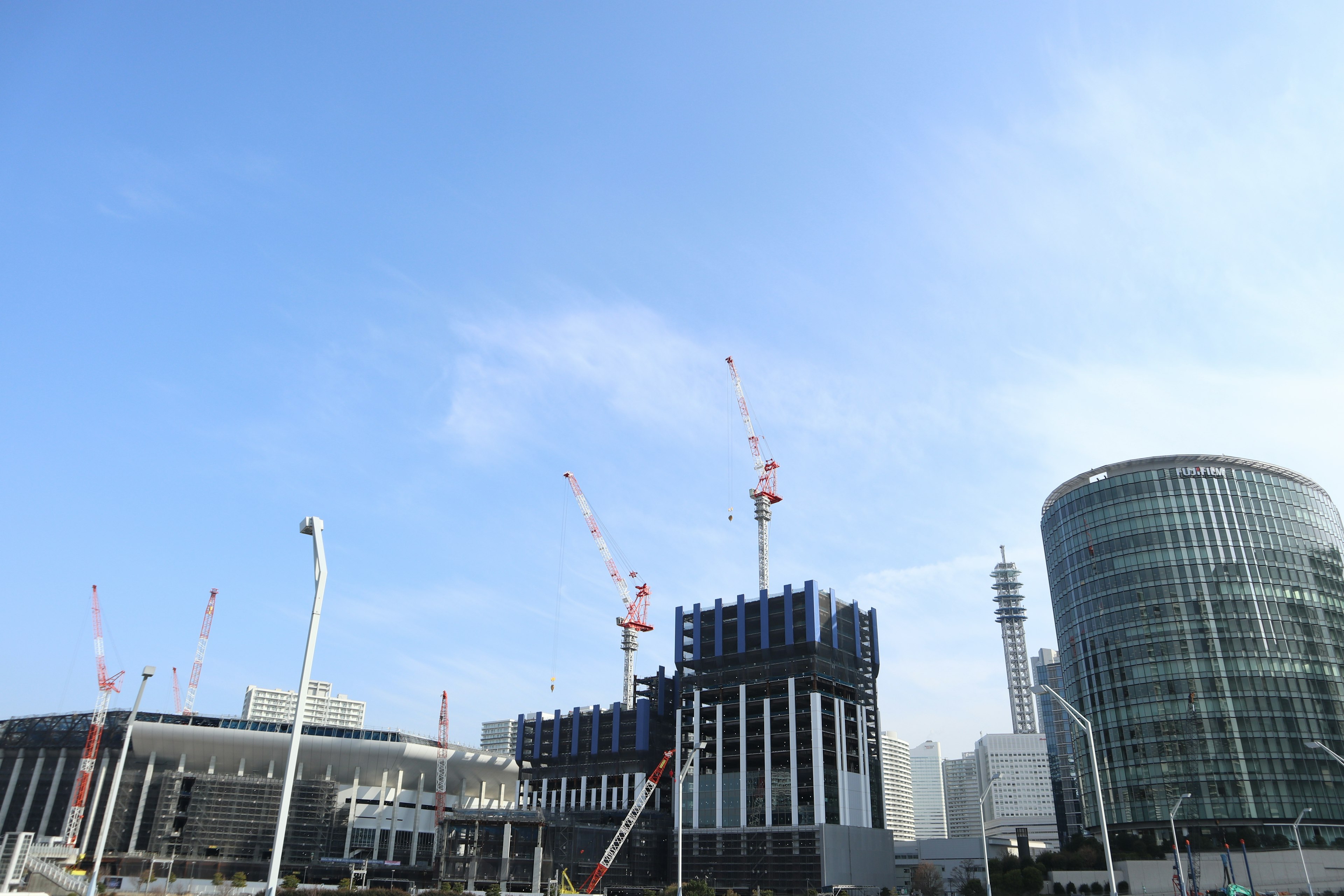 Construction site featuring high-rise buildings and a clear blue sky