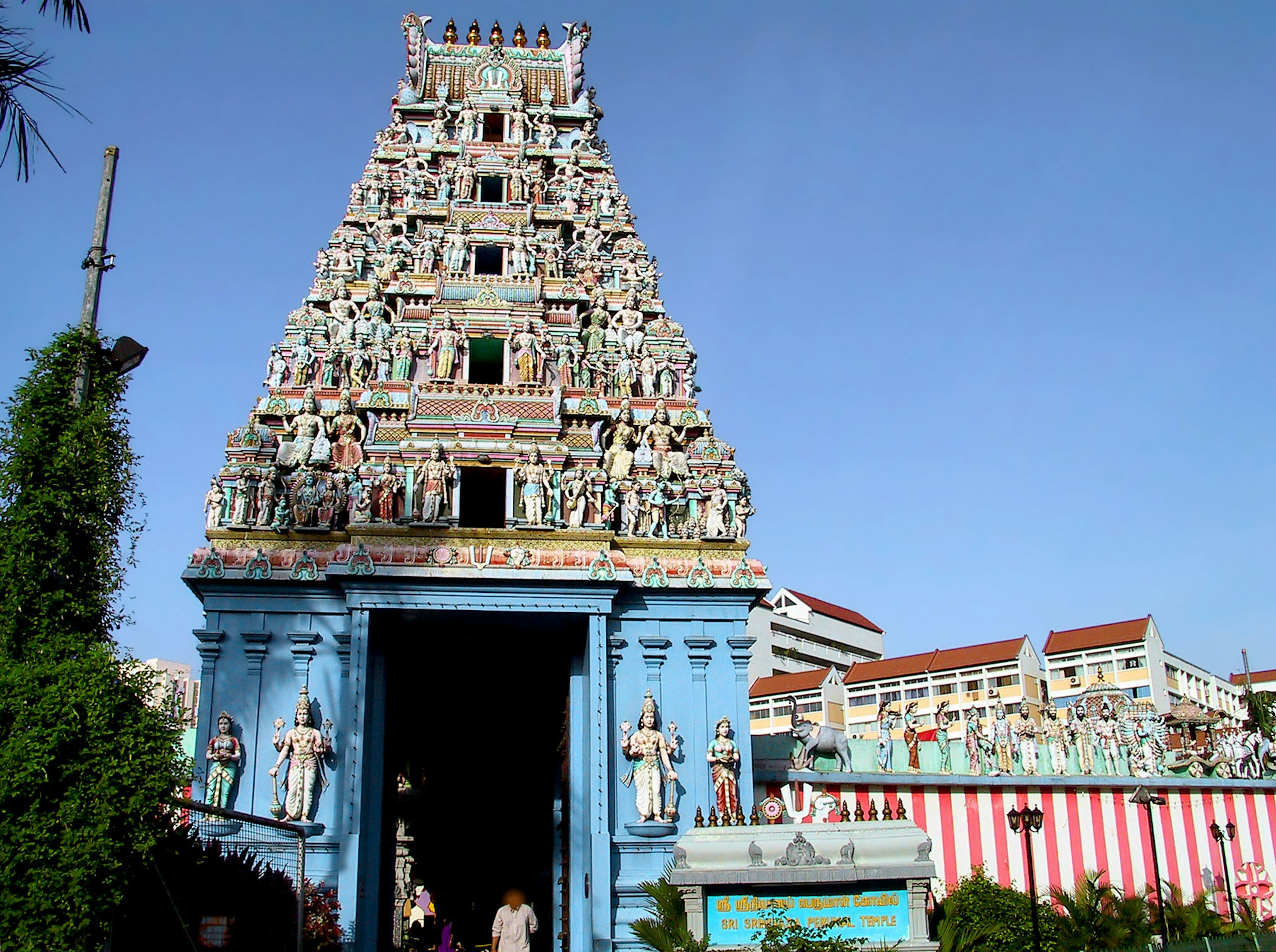 Colorful temple tower adorned with intricately carved deities