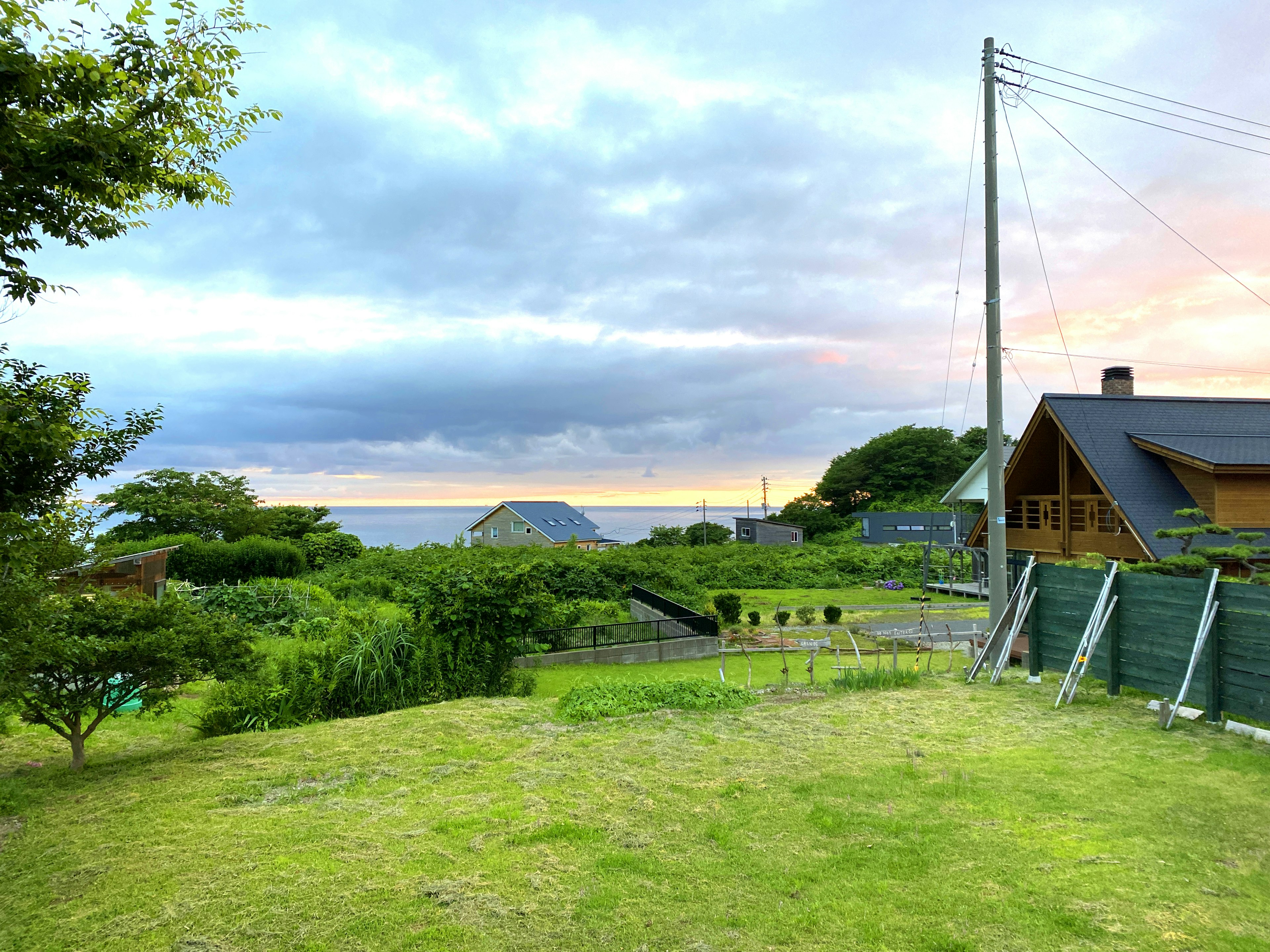 Lush landscape with a view of the sea and houses