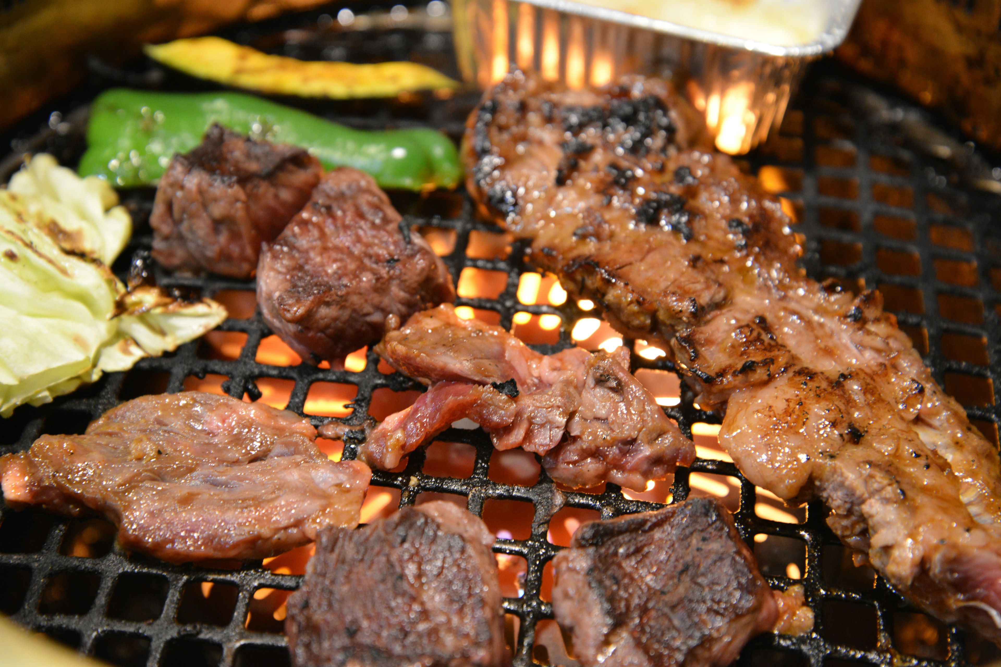 Grilled meat and vegetables on a barbecue grill