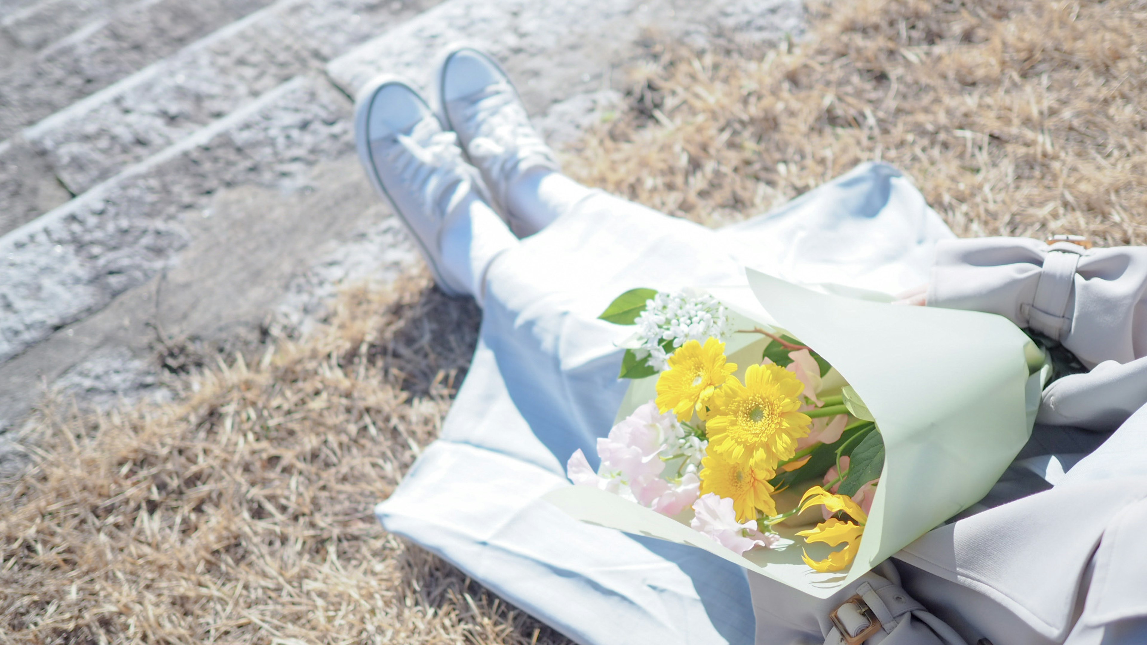 A serene scene featuring a bouquet and white shoes