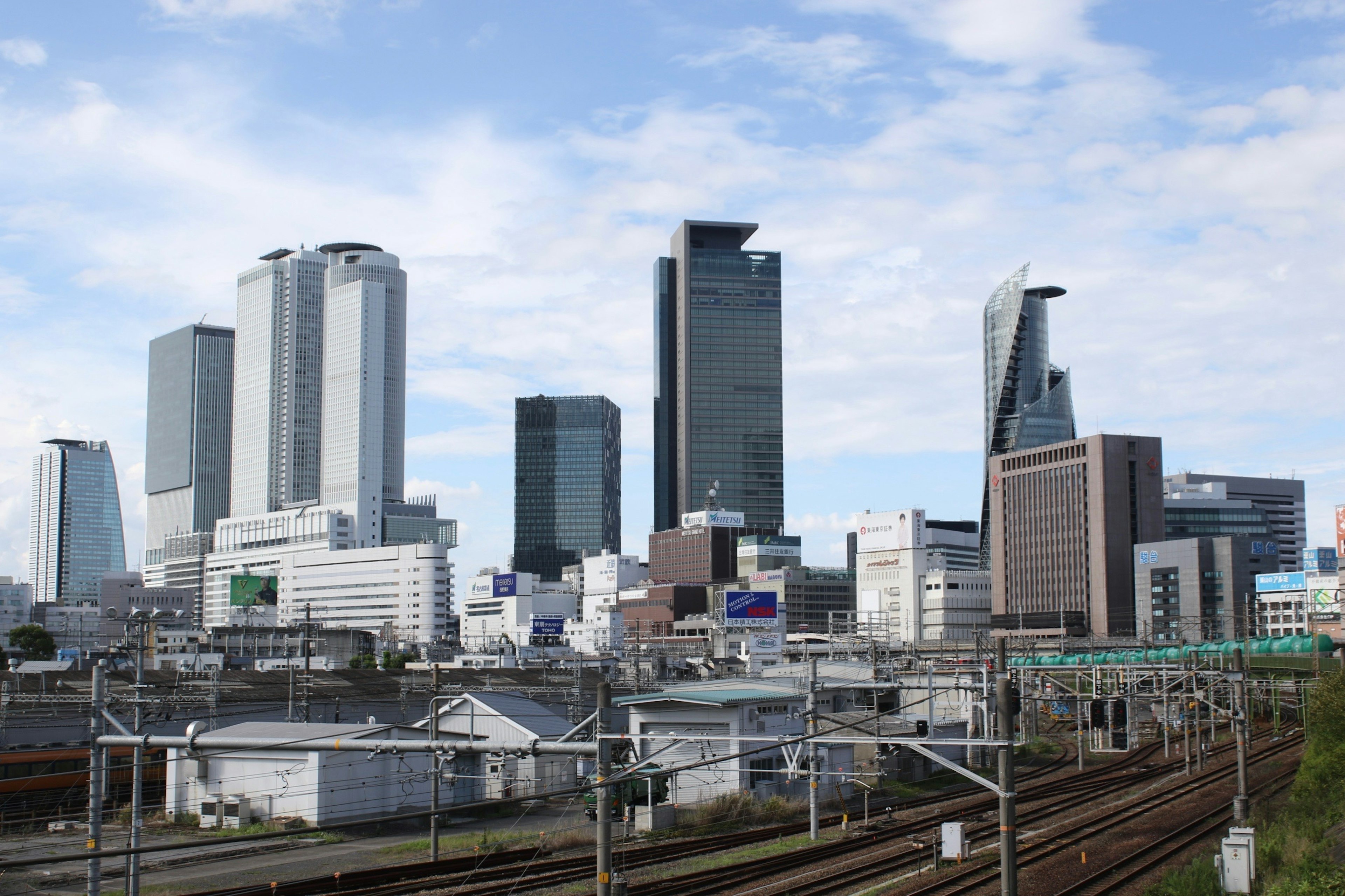 City skyline featuring modern skyscrapers and rail tracks