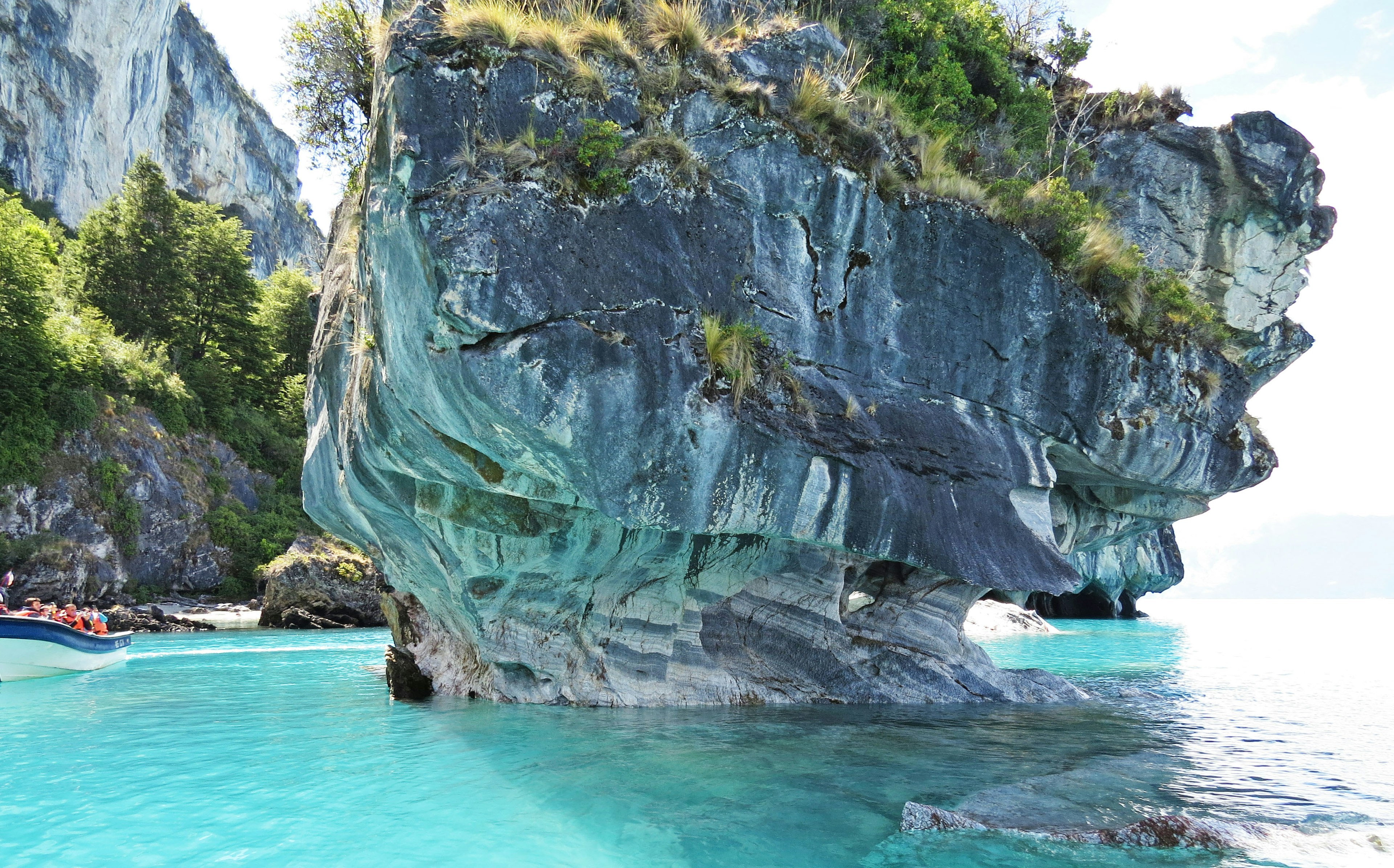 Unique rock formation surrounded by turquoise water